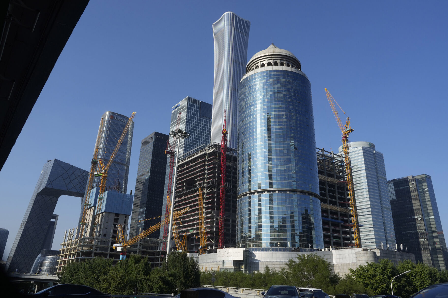 <p>FILE - Construction cranes are seen near the central business district in Beijing, Aug. 8, 2024. (AP Photo/Ng Han Guan, File)</p>   PHOTO CREDIT: Ng Han Guan 