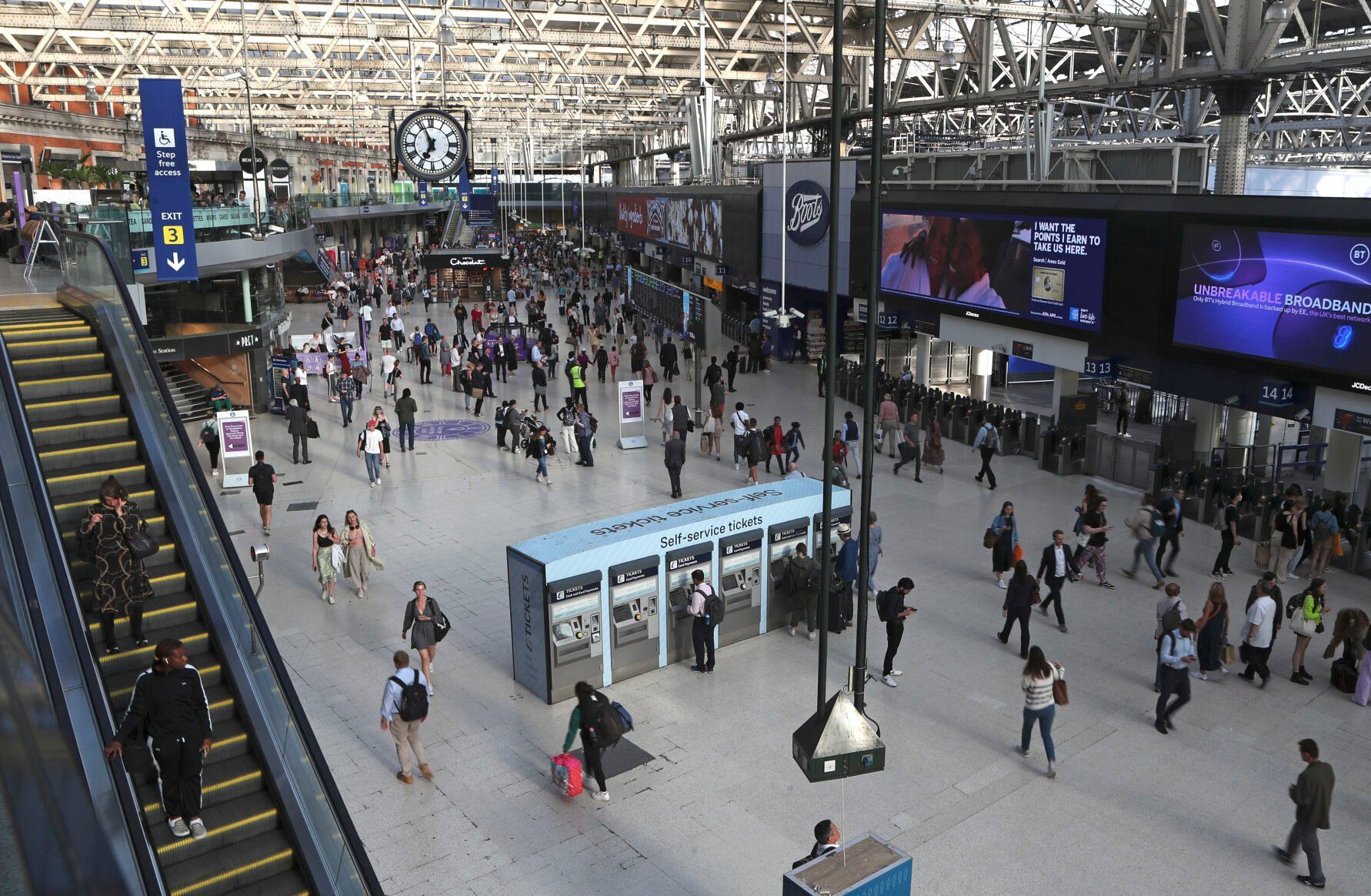 <p>FILE -Commuters walk inside Waterloo station in London, June 20, 2022.(AP Photo/Tony Hicks), File)</p>   PHOTO CREDIT: Tony Hicks 