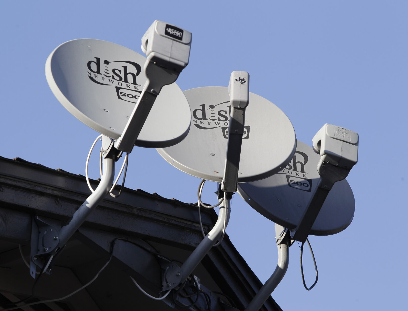 <p>FILE - In this Feb. 23, 2011, file photo, Dish Network satellite dishes are shown at an apartment complex in Palo Alto, Calif. (AP Photo/Paul Sakuma, File)</p>   PHOTO CREDIT: Paul Sakuma 