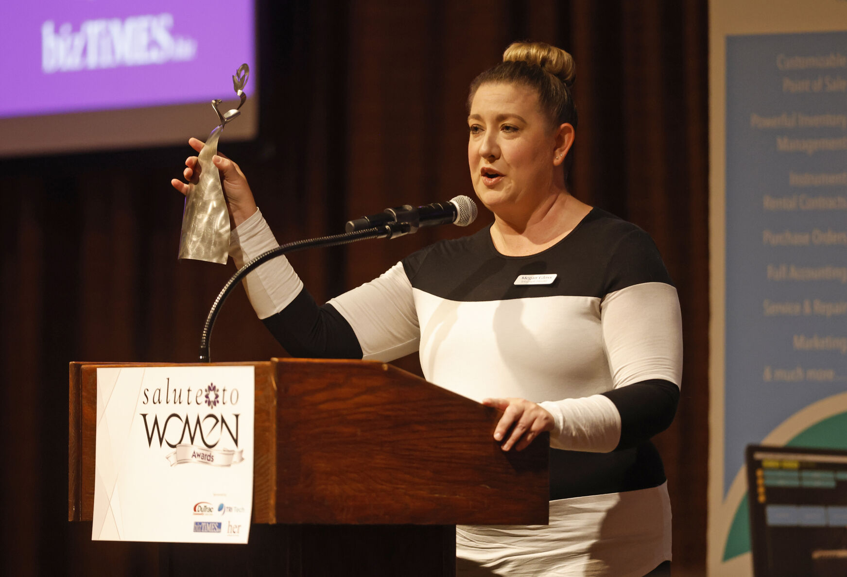 Megan Gloss, features editor at Telegraph Herald, speaks during the Salute to Women Awards at Diamond Jo Casino in Dubuque on Wednesday, Oct. 4, 2023.    PHOTO CREDIT: JESSICA REILLY