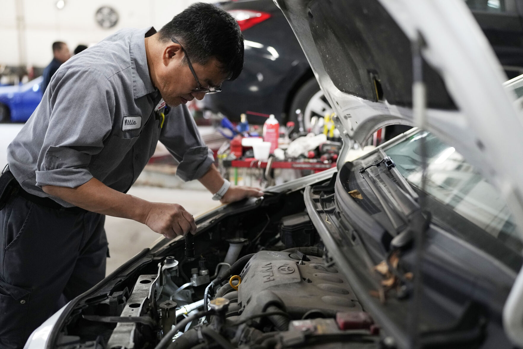 <p>Auto mechanic Willie Chung works on a vehicle at the Express Auto Service Inc., in Chicago, Thursday, Sept. 19, 2024. (AP Photo/Nam Y. Huh)</p>   PHOTO CREDIT: Nam Y. Huh 