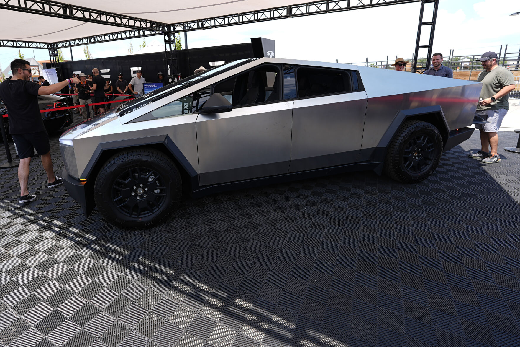 <p>FILE - Visitors look over a 2024 Cybertruck in the Tesla display at the Electrify Expo, July 14, 2024, in north Denver. (AP Photo/David Zalubowski, File)</p>   PHOTO CREDIT: David Zalubowski 