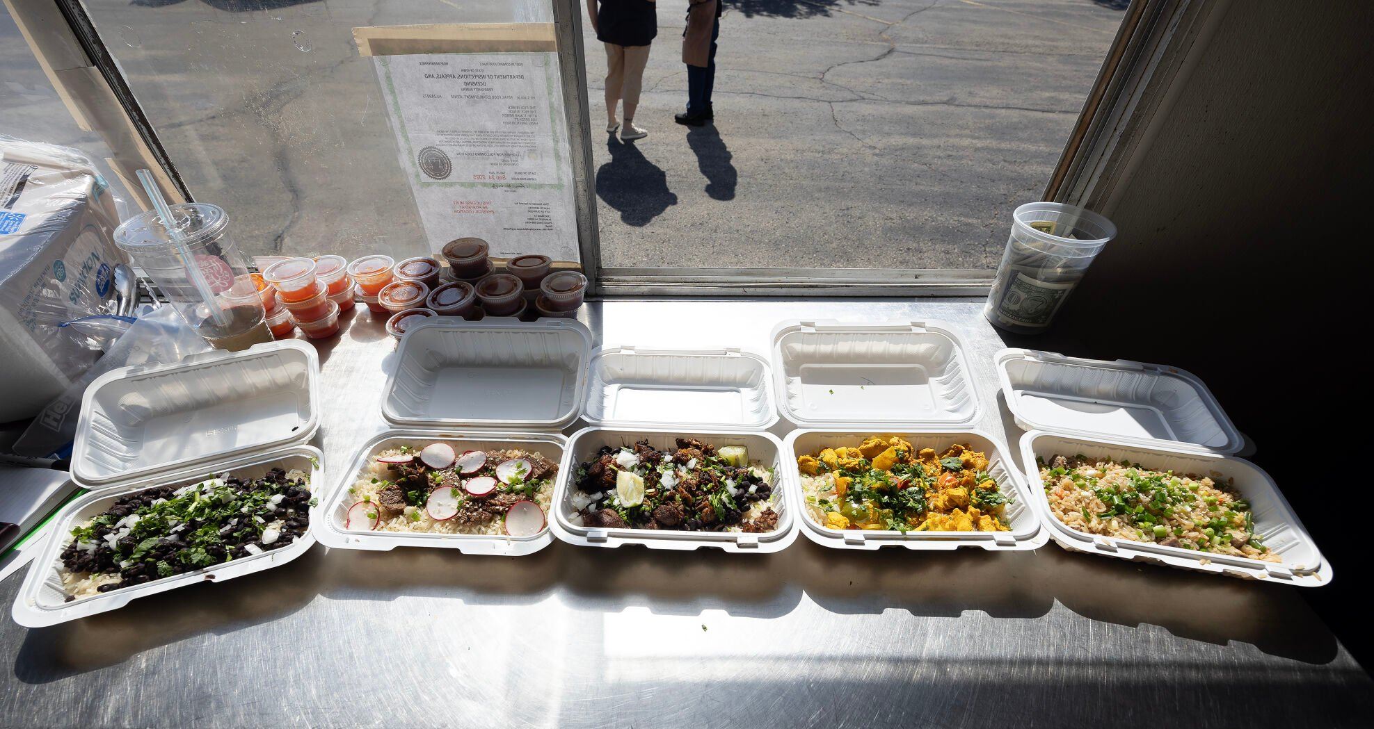 Meals sit on the counter of Rice is Nice food truck in Cuba City, Wis., on Saturday.    PHOTO CREDIT: Stephen Gassman