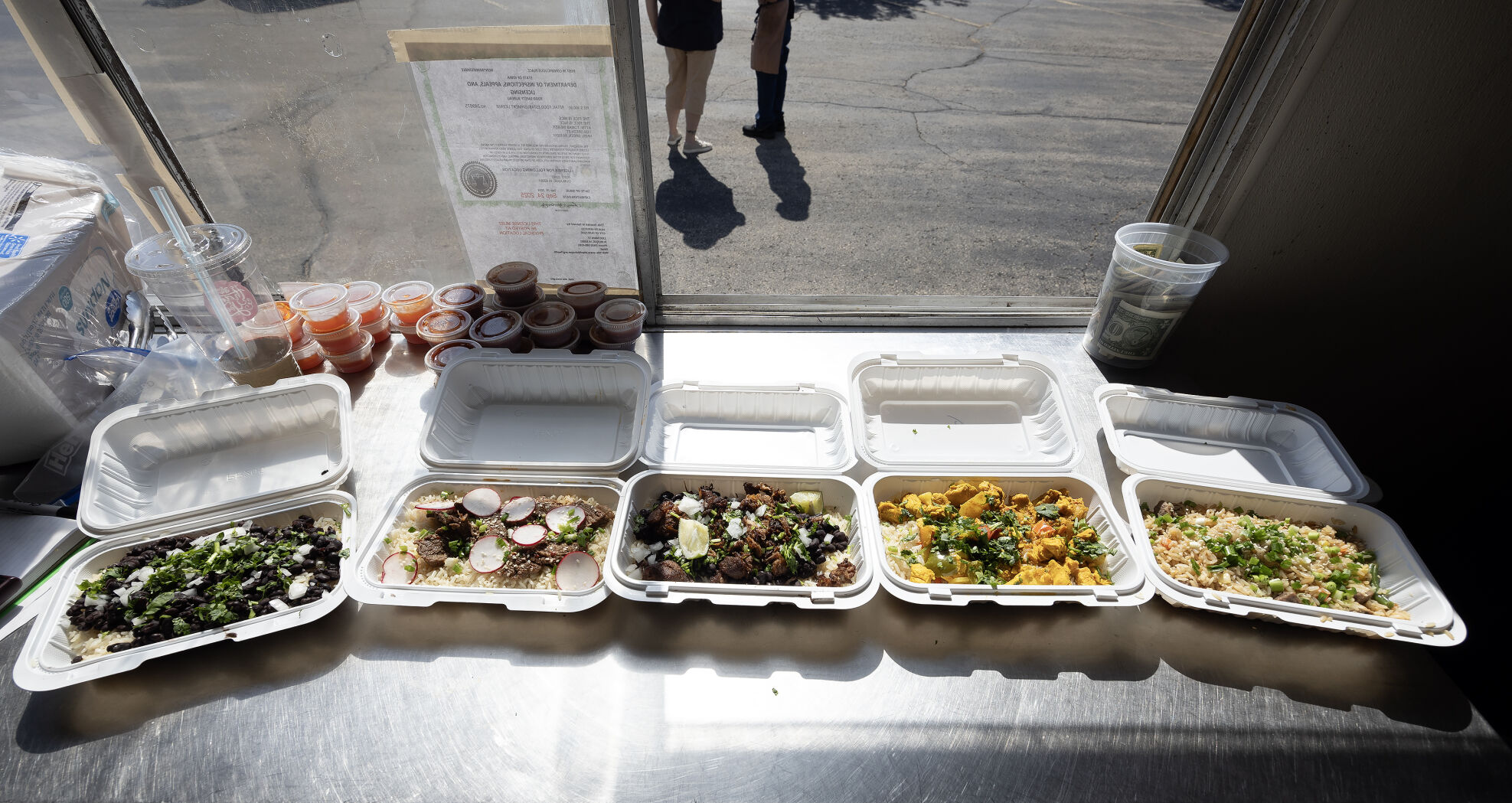 Meals sit on the counter of Rice is Nice food truck in Cuba City, Wis., on Saturday, Oct. 5, 2024.    PHOTO CREDIT: Stephen Gassman