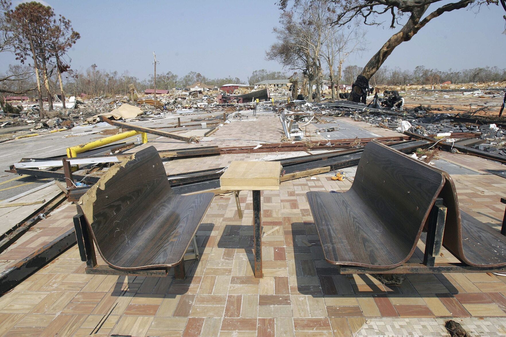 FILE - Only the benches remain at what was a Waffle House restaurant on the beachfront area in Gulfport, Miss., Sept. 20, 2005, following Hurricane Katrina. (AP Photo/Ric Feld, File)    PHOTO CREDIT: Associated Press