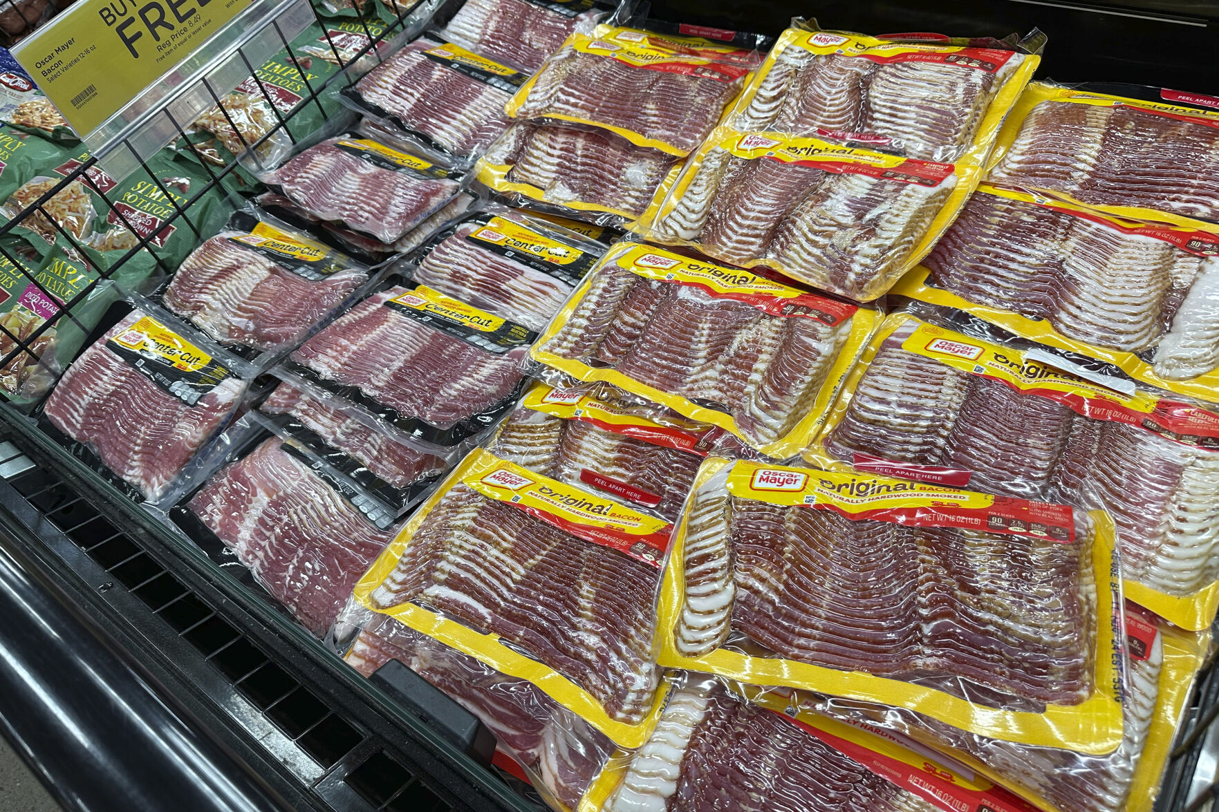 Oscar Mayer bacon packages are on display in a refrigerated case in a King Soopers grocery store Monday, Oct. 7, 2024, in southeast Denver. (AP Photo/David Zalubowski)    PHOTO CREDIT: Associated Press