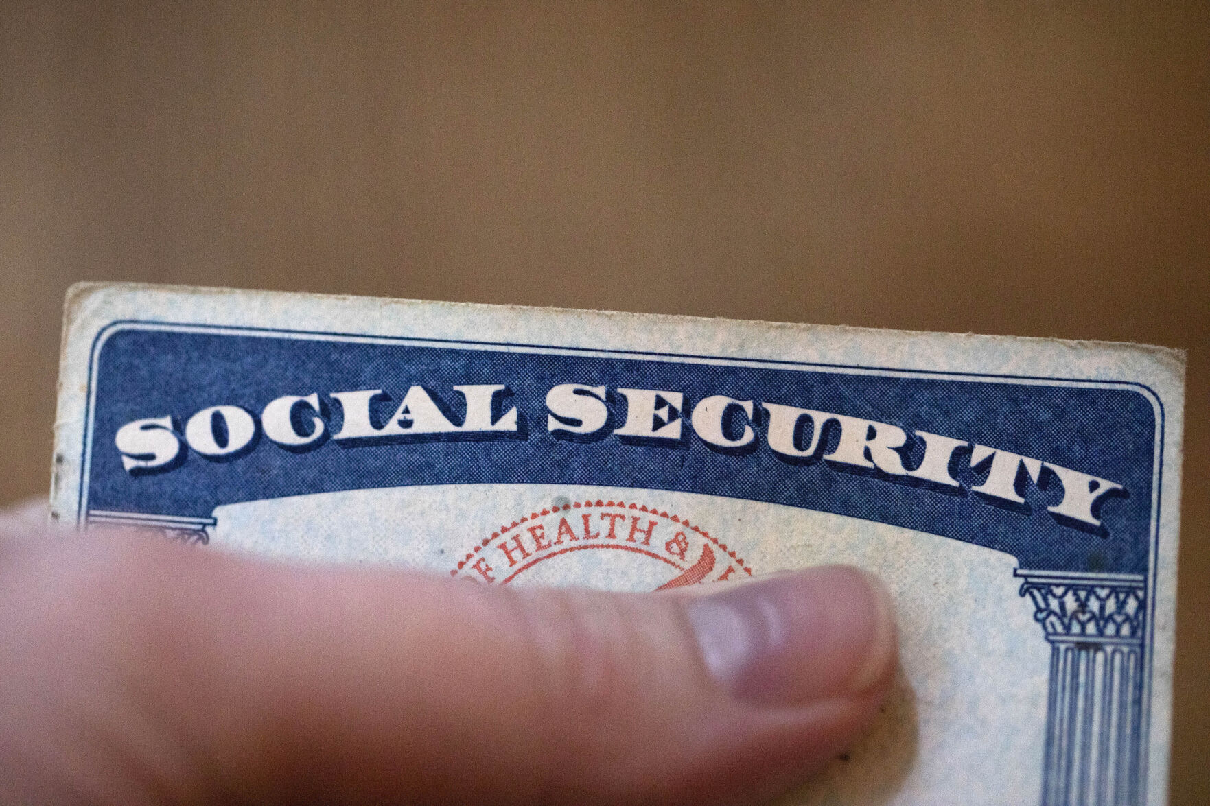 FILE - A Social Security card is displayed on Oct. 12, 2021, in Tigard, Ore. (AP Photo/Jenny Kane, File)    PHOTO CREDIT: Associated Press