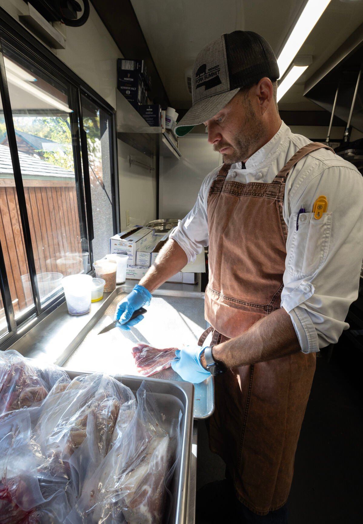 Apple Blossom Catering owner chef Jason Culbertson works in his catering trailer in Dubuque on Thursday, Oct. 10, 2024.    PHOTO CREDIT: Stephen Gassman