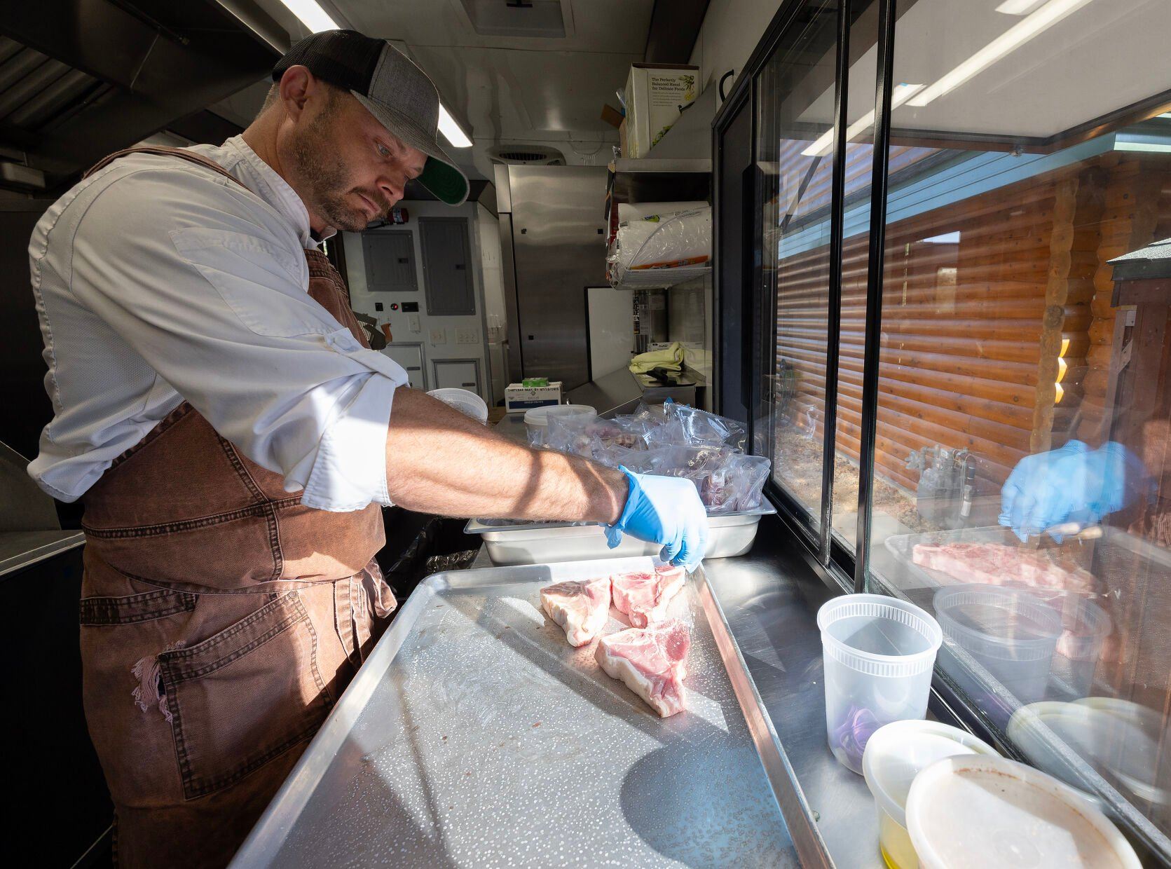 Apple Blossom Catering owner chef Jason Culbertson works in his catering trailer in Dubuque on Thursday, Oct. 10, 2024.    PHOTO CREDIT: Stephen Gassman