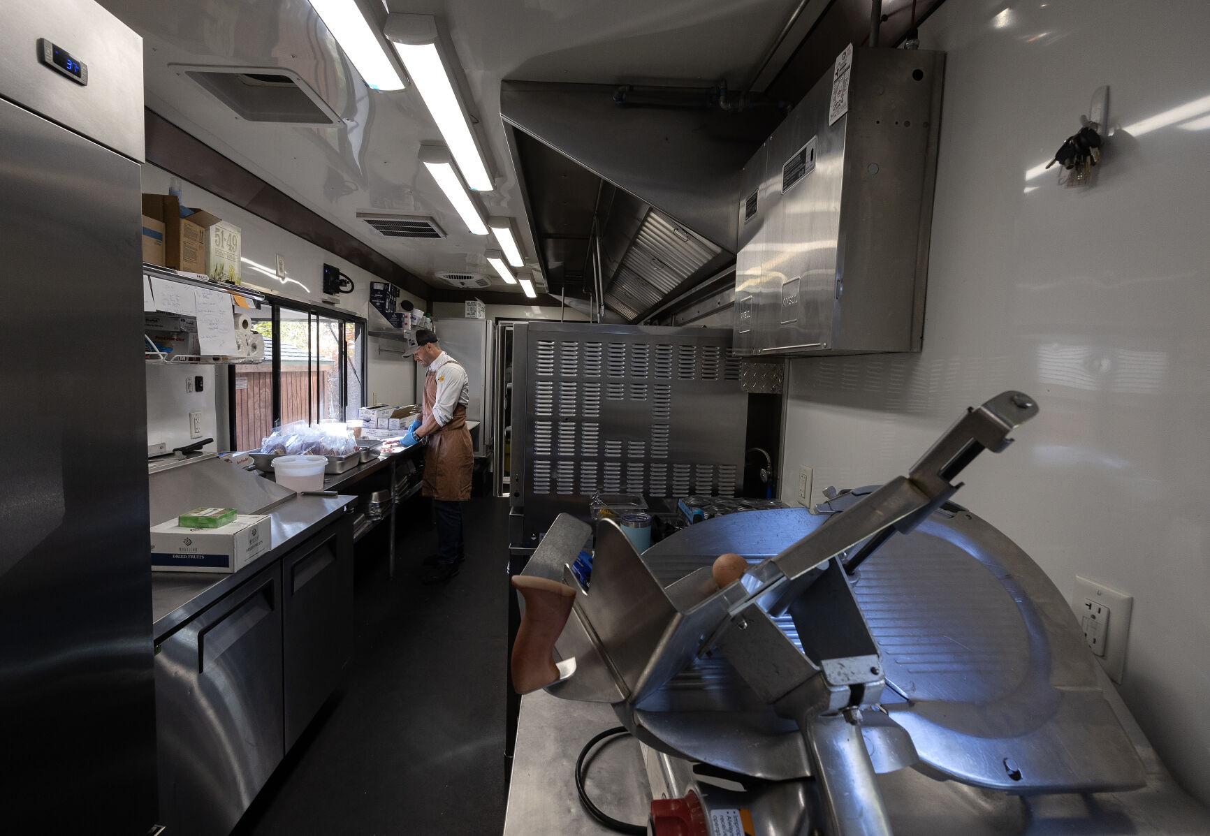 Apple Blossom Catering owner chef Jason Culbertson works in his catering trailer in Dubuque on Thursday, Oct. 10, 2024.    PHOTO CREDIT: Stephen Gassman