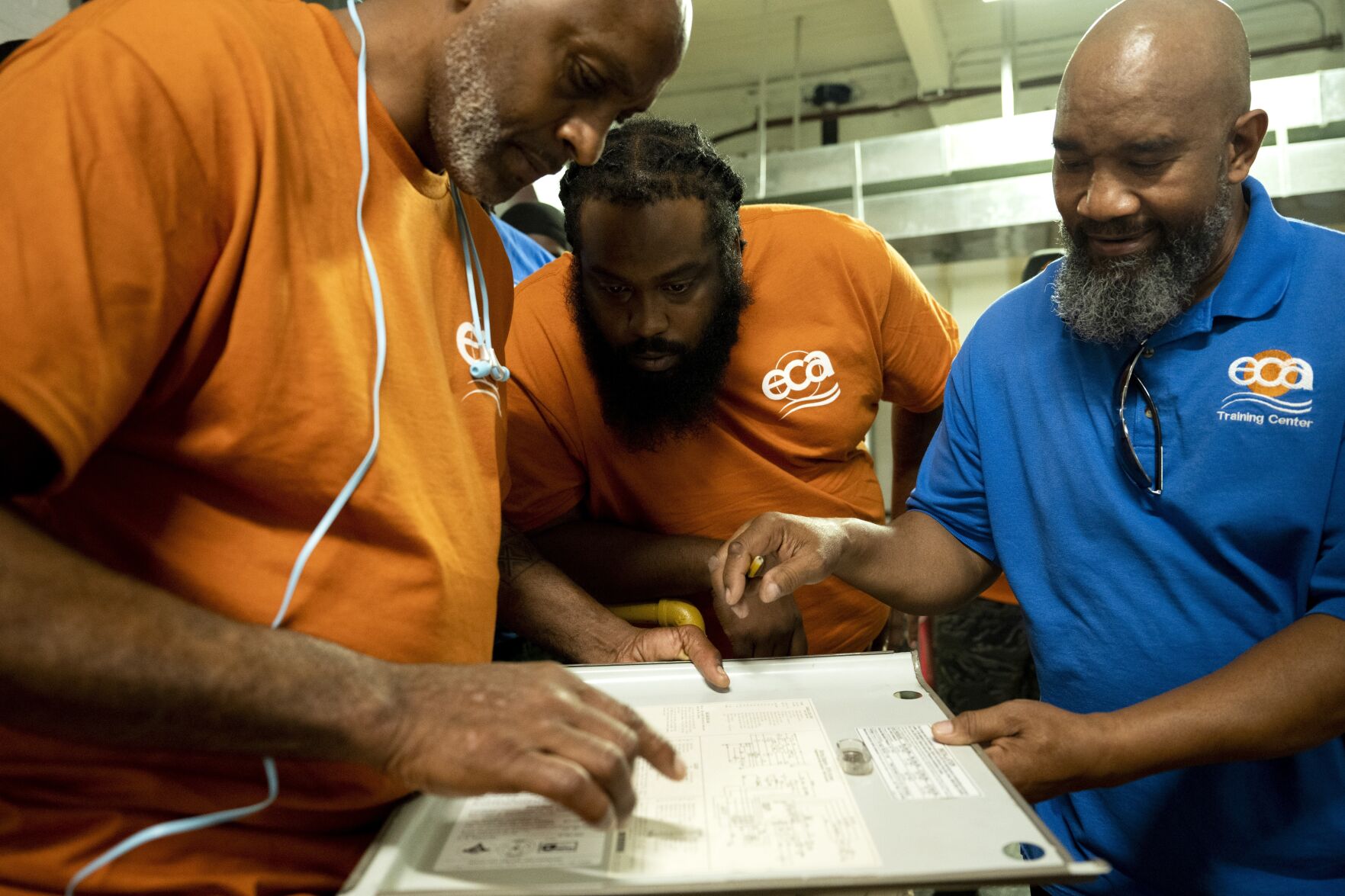 <p>Jackie Robinson, right, an instructor at the Energy Coordinating Agency, a nonprofit focused in part on energy equity, teaches a class at the facility on Tuesday, July 2, 2024, in Philadelphia. (AP Photo/Joe Lamberti)</p>   PHOTO CREDIT: Joe Lamberti 