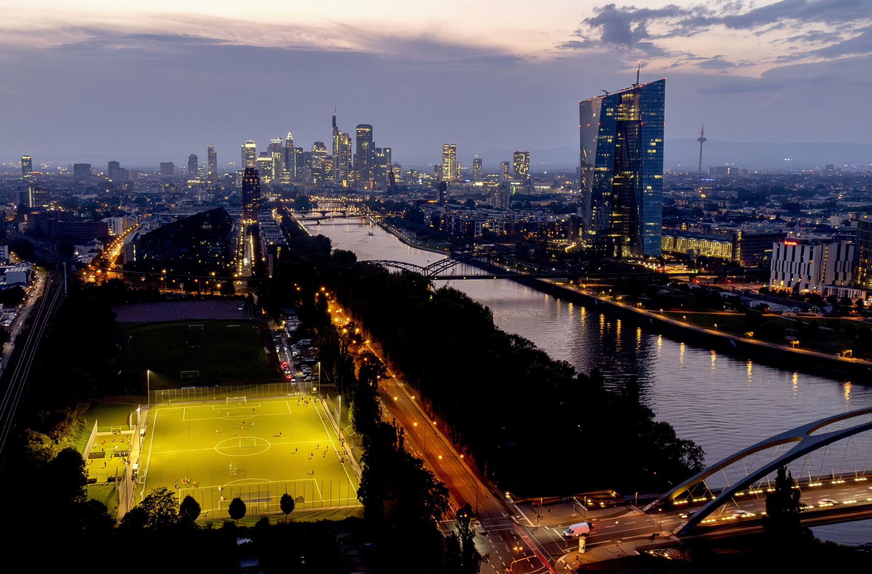 <p>FILE - The European Central Bank stands at right as soccer players practise on a field next to the river Main, in Frankfurt, Germany, late Thursday, Sept. 19, 2024. (AP Photo/Michael Probst, File)</p>   PHOTO CREDIT: Michael Probst