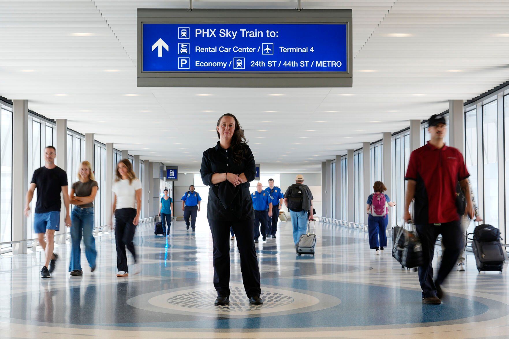 <p>Lindsay Ruck, a server at Phoenix Sky Harbor International Airport restaurants, pauses in Terminal 3 as she is anticipates the vote on Arizona Prop 138 on minimum wage Thursday, Oct. 3, 2024, in Phoenix. (AP Photo/Ross D. Franklin)</p>   PHOTO CREDIT: Ross D. Franklin 