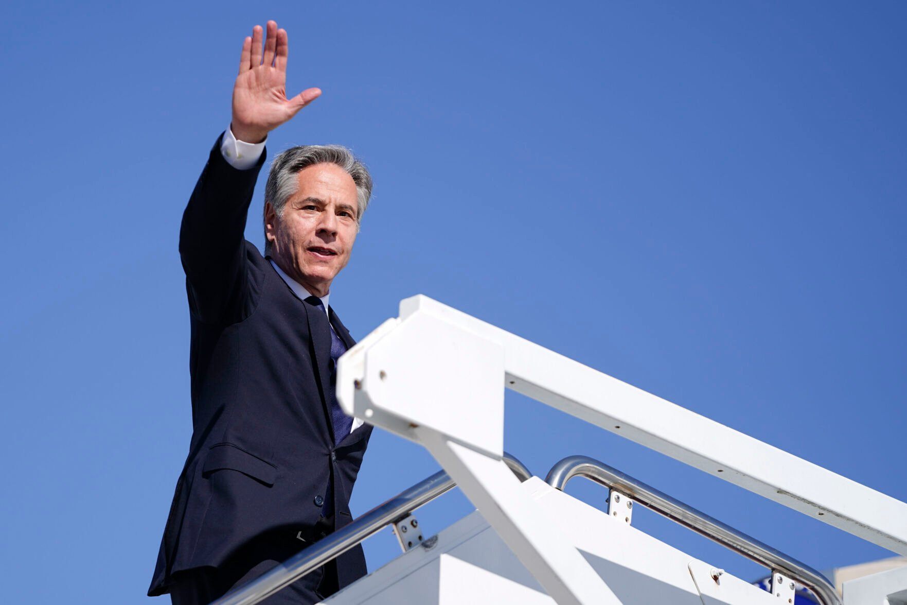 <p>Secretary of State Antony Blinken waves as he boards a plane en route to the Middle East as he departs Joint Base Andrews, Md., Monday, Oct. 21, 2024. (Nathan Howard/Pool Photo via AP)</p>   PHOTO CREDIT: Nathan Howard -