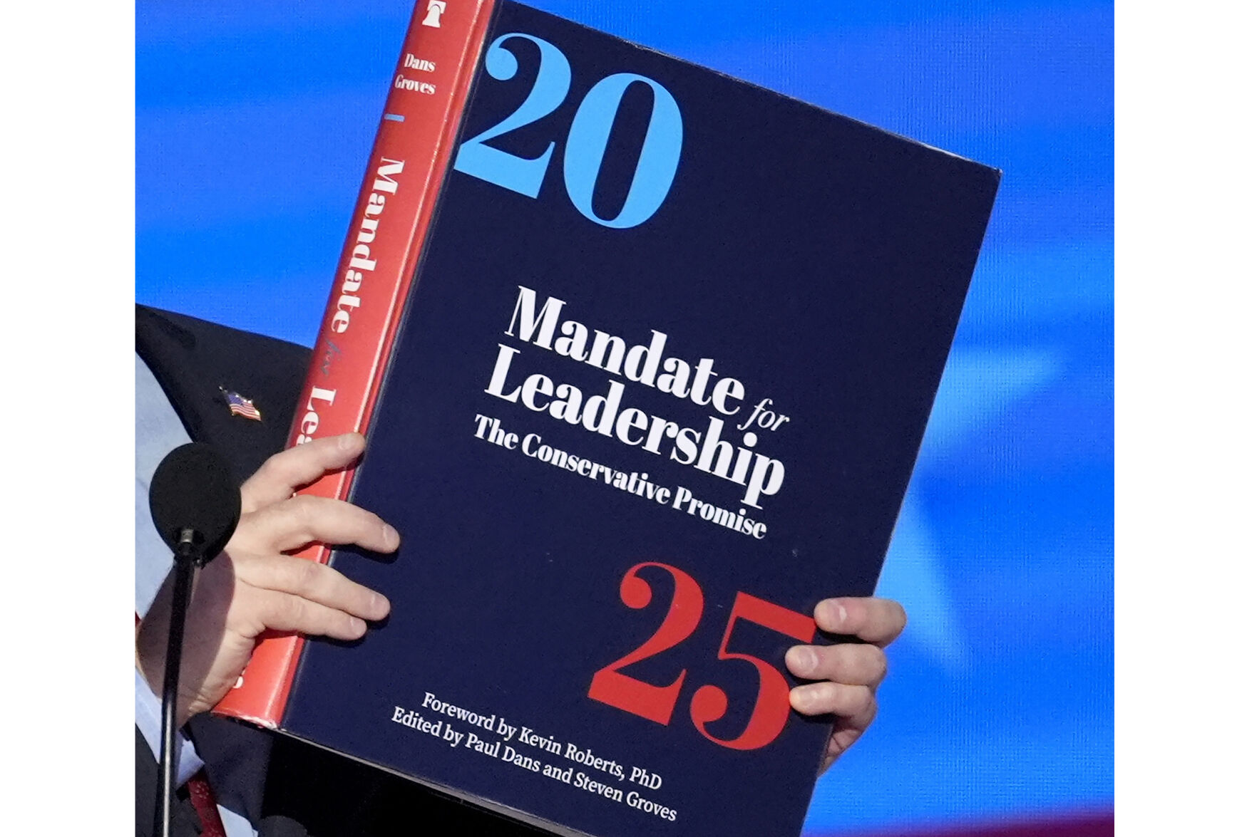 <p>A copy of Project 2025 is held during the Democratic National Convention, Aug. 21, 2024, in Chicago. For a year, Project 2025 has endured as a persistent force in the presidential election. It’s rare for a complex 900-page policy book to figure so dominantly in a political campaign. (AP Photo/J. Scott Applewhite)</p>   PHOTO CREDIT: J. Scott Applewhite -