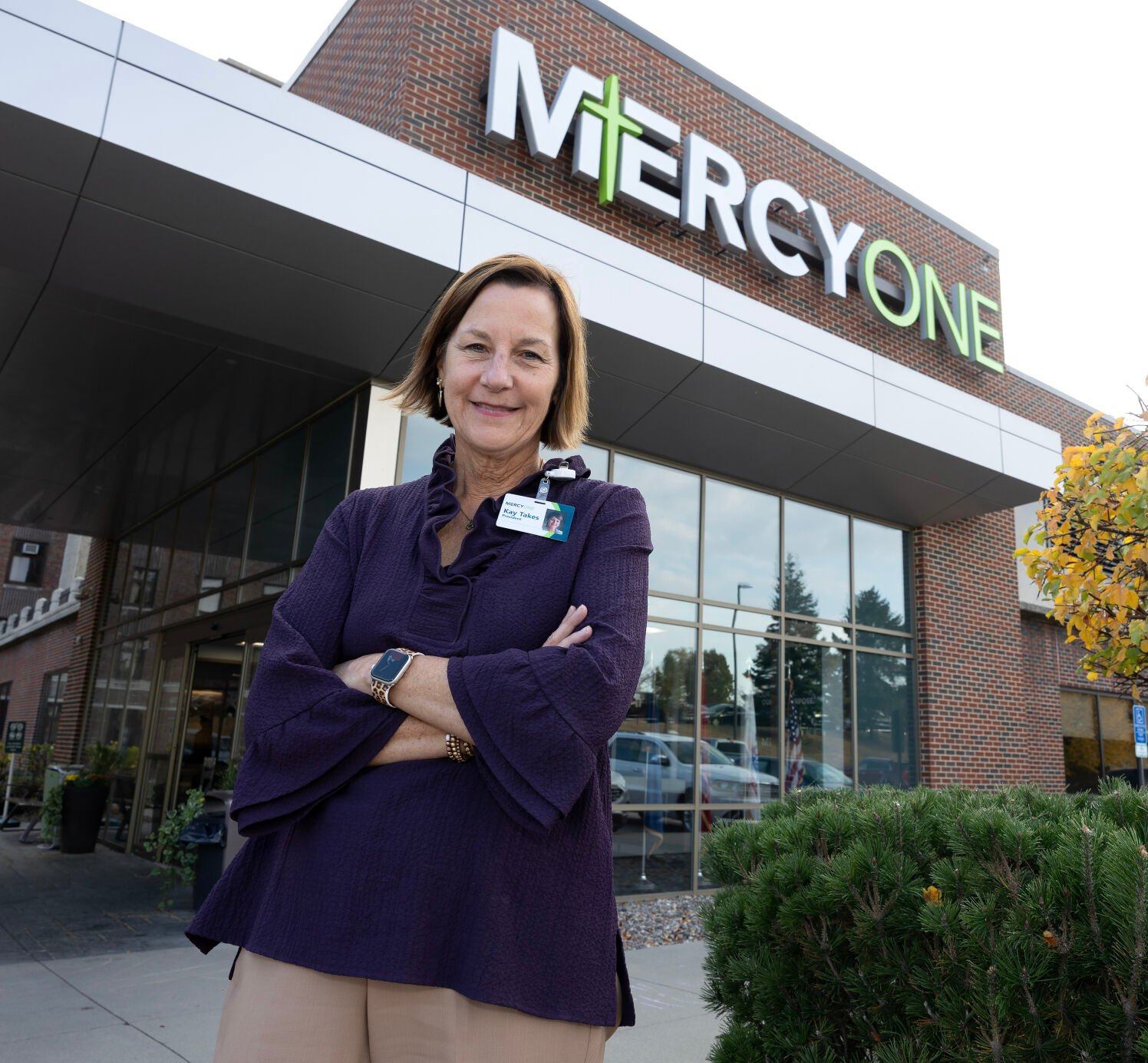 Kay Takes poses in front of MercyOne Dubuque Medical Center on Tuesday.    PHOTO CREDIT: Gassman