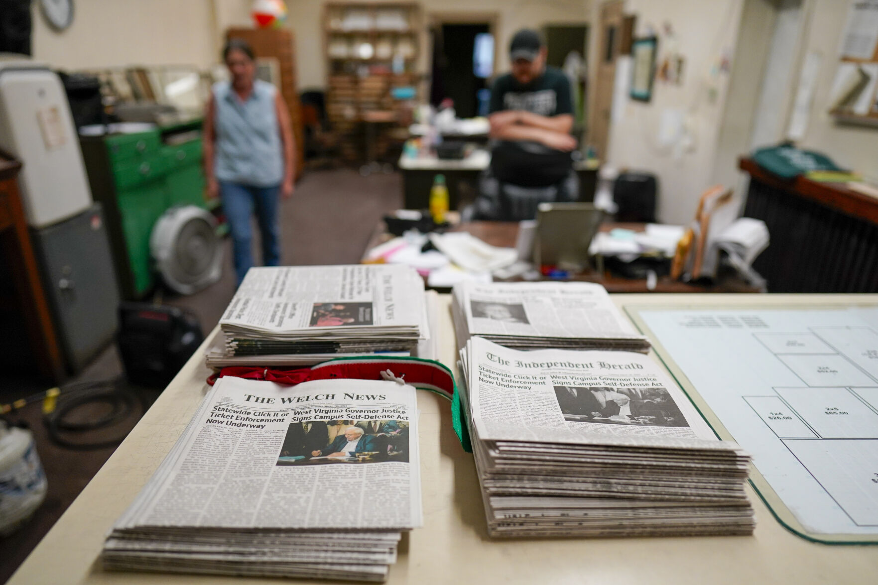 <p>FILE - Missy Nester owner of the The Welch News walks around the closed office, May 31, 2023, in Welch, W.Va. (AP Photo/Chris Carlson, File)</p>   PHOTO CREDIT: Chris Carlson 