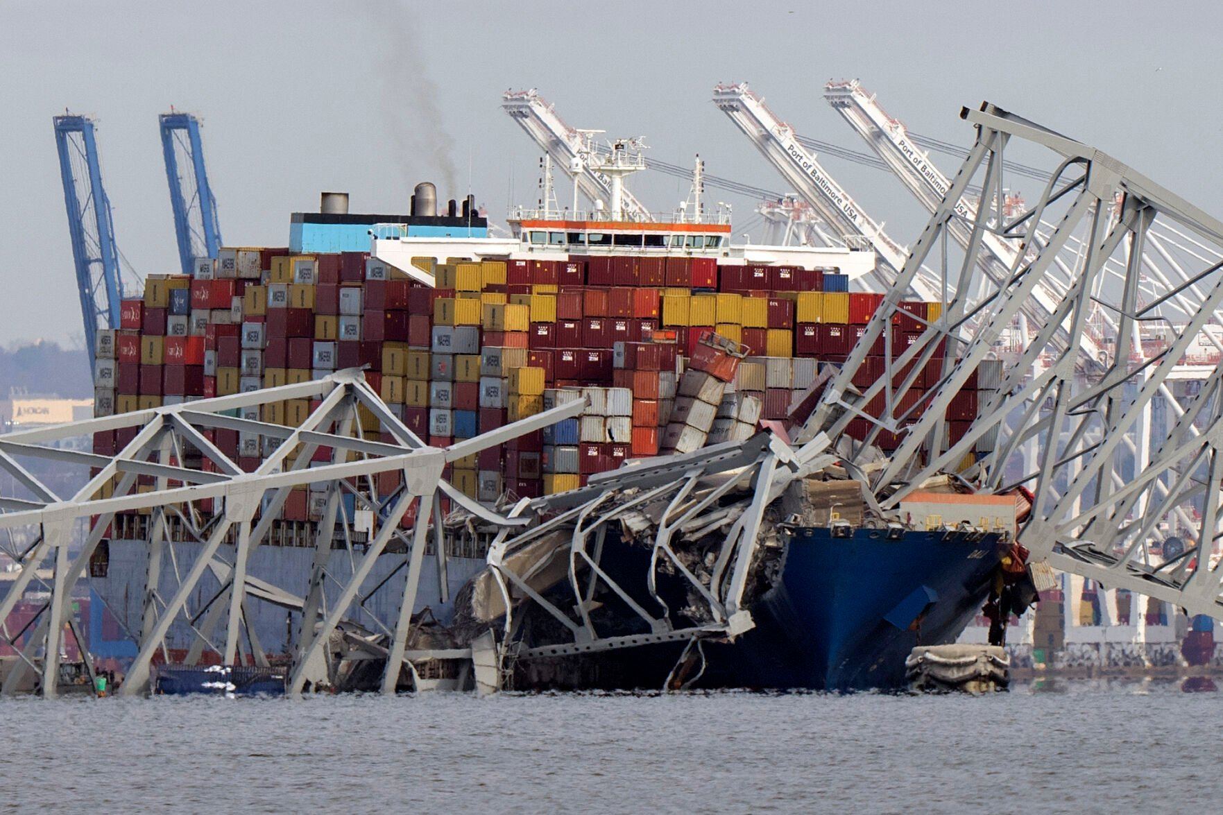 <p>FILE - The cargo ship Dali is stuck under part of the structure of the Francis Scott Key Bridge after the ship hit the bridge, Tuesday, March 26, 2024, as seen from Pasadena, Md. (AP Photo/Mark Schiefelbein, File)</p>   PHOTO CREDIT: Mark Schiefelbein - staff, ASSOCIATED PRESS