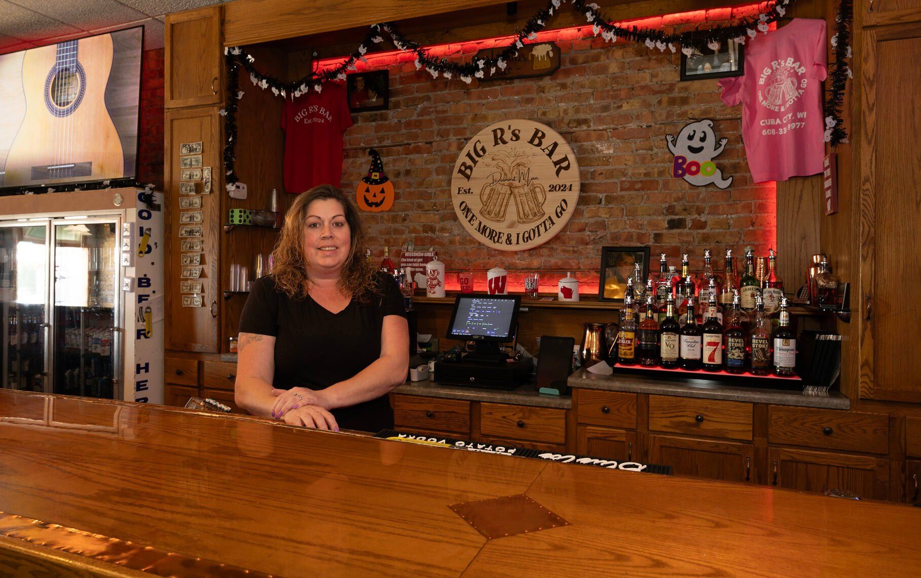 Owner Victoria Richter stands behind the bar at Big R’s Bar in Cuba City, Wis.    PHOTO CREDIT: Gassman