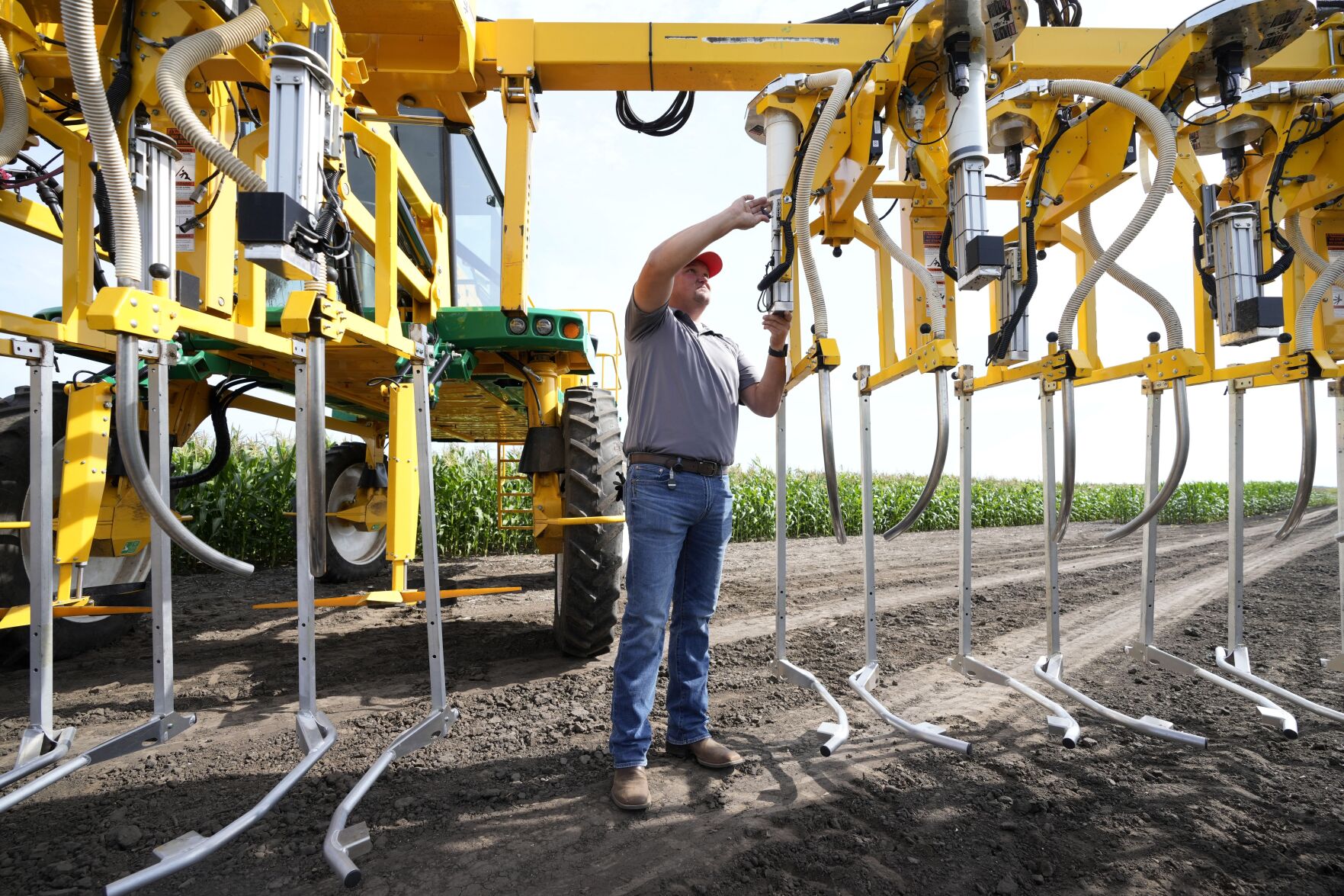 <p>Jake Klocke, of PowerPollen, prepares a pollen applicator, Thursday, Aug. 22, 2024, near Ames, Iowa. (AP Photo/Charlie Neibergall)</p>   PHOTO CREDIT: Charlie Neibergall 