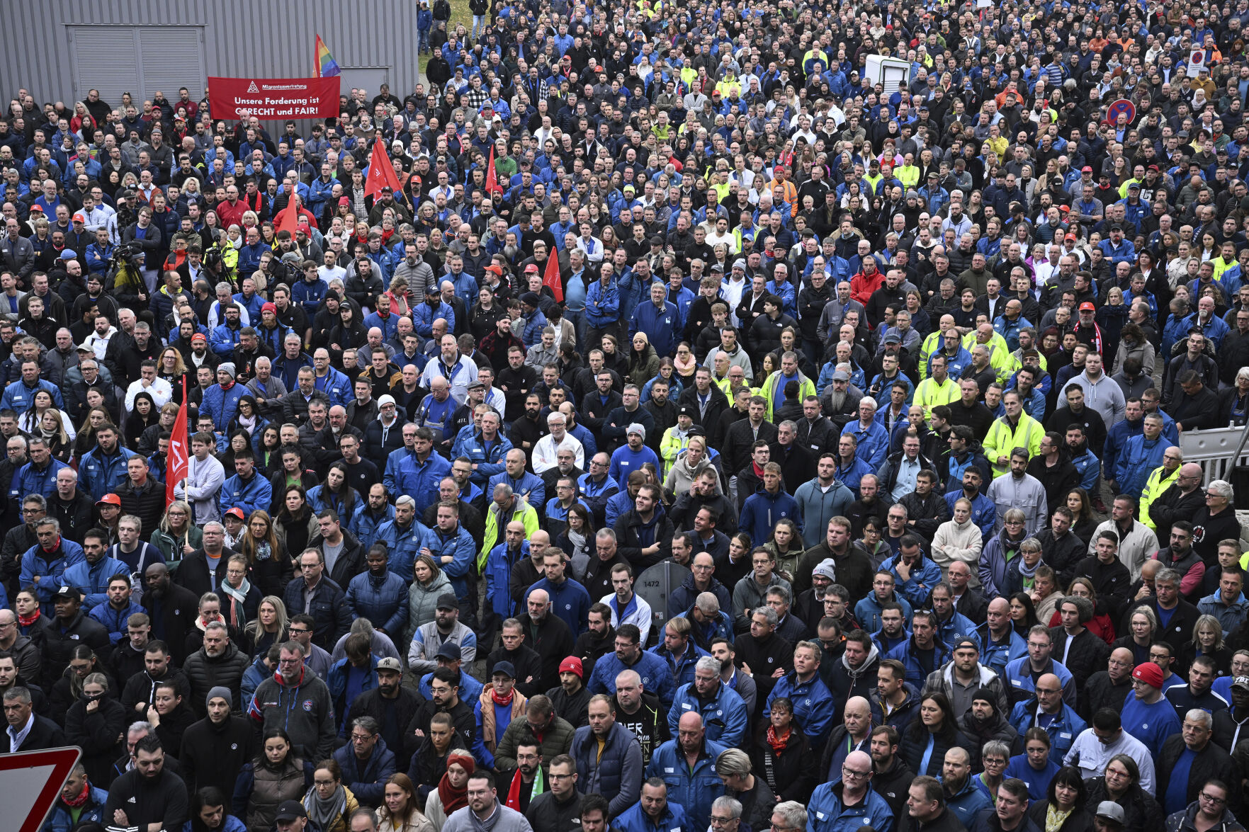 <p>Employees stand at an information event organized by the General Works Council of Volkswagen AG at the VW main plant in Wolfsburg, Oct. 28, 2024. (Julian Stratenschulte/DPA via AP, Pool)</p>   PHOTO CREDIT: Julian Stratenschulte