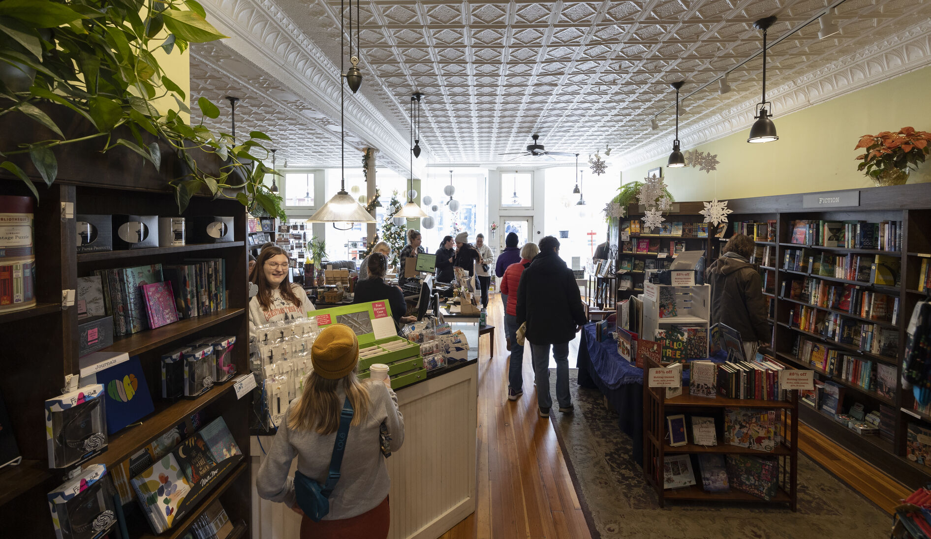 Shoppers browse books at River Lights Bookstore in Dubuque during Small Business Saturday.    PHOTO CREDIT: File photo