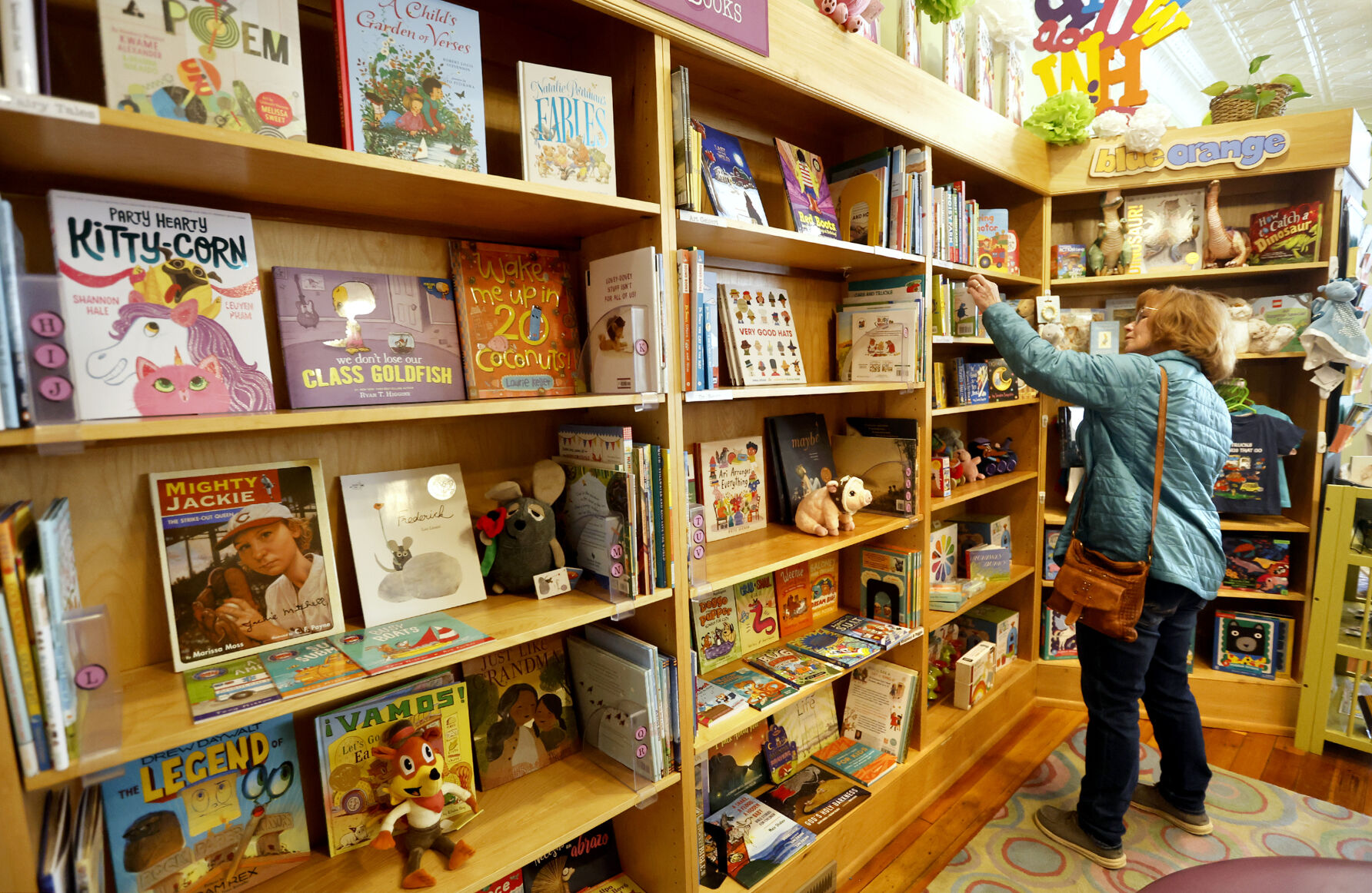 Molly Burger, of Dubuque, browses books at River Lights Bookstore.    PHOTO CREDIT: File photo