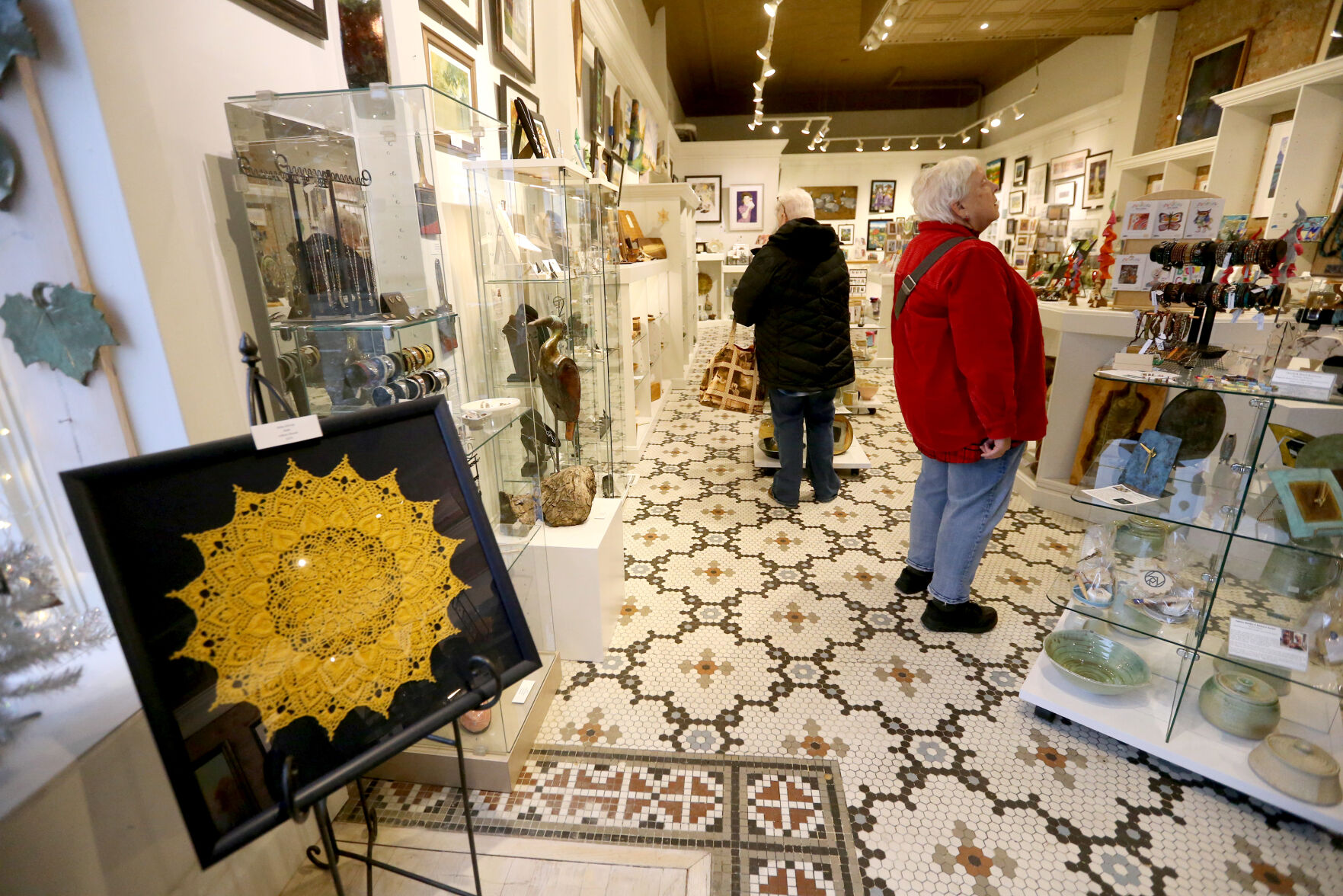 Kathleen Cody (left) and Jan Cody, both of Dubuque, shop at Outside the Lines Art Gallery in Dubuque.    PHOTO CREDIT: File photo