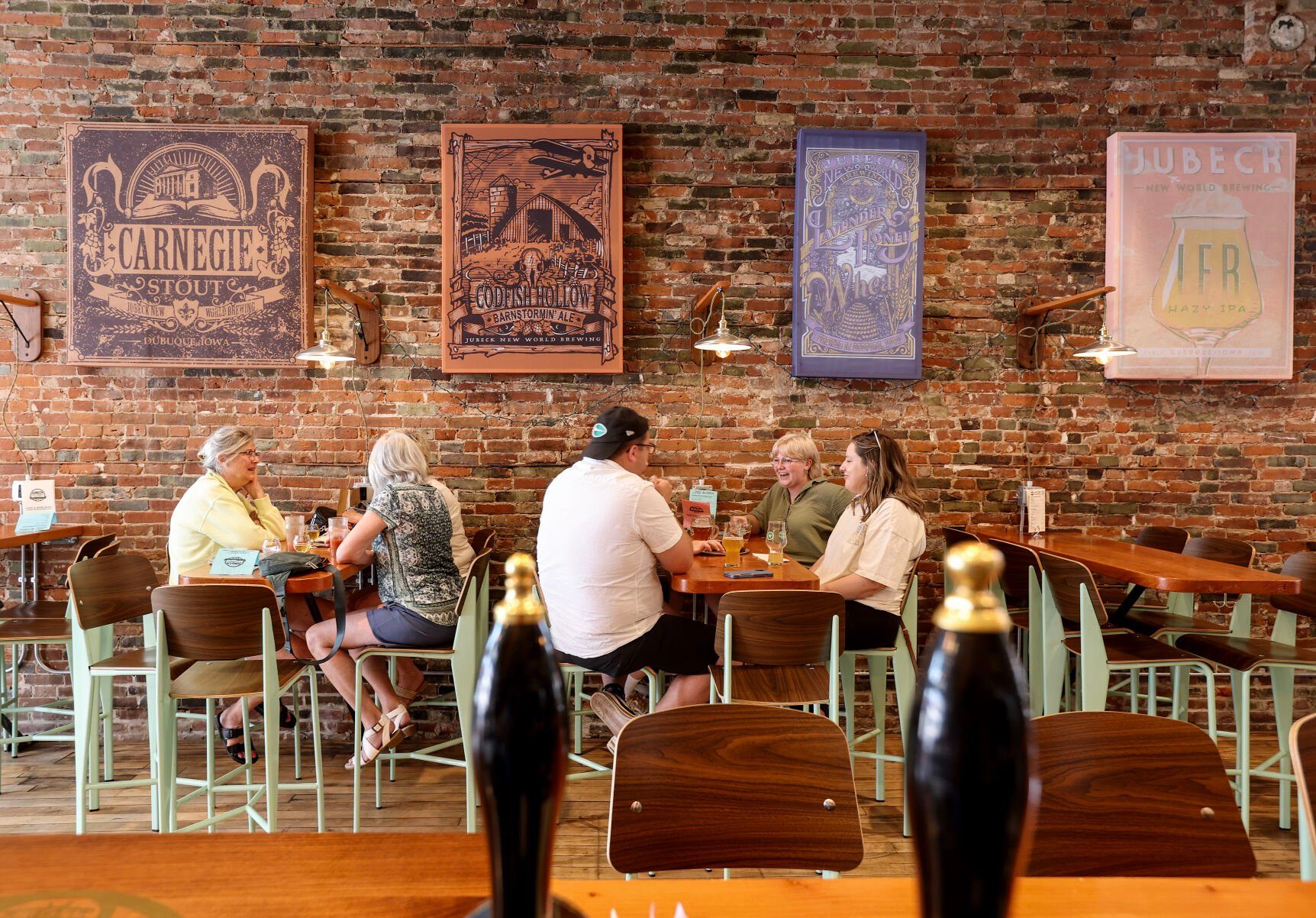 People chat inside Jubeck New World Brewing in Dubuque.    PHOTO CREDIT: File photo