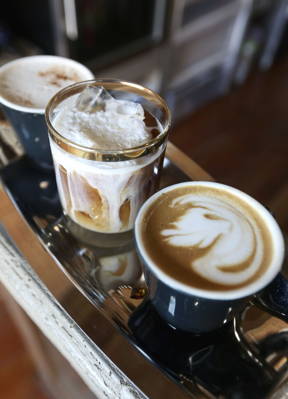 A coffee flight, consisting of a chai latte (from left), a semi-frozen sweet cream cold brew, and a Mayan Mocha. Photo taken at Devour Cafe in Dubuque.    PHOTO CREDIT: File photo