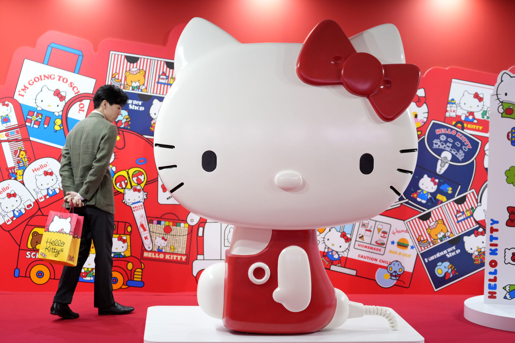 <p>A visitor looks at giant Hello Kitty display at the exhibition "As I change, so does she," marking the 50th anniversary of Hello Kitty at the Tokyo National Museum in Tokyo Wednesday, Oct. 30, 2024. (AP Photo/Shuji Kajiyama)</p>   PHOTO CREDIT: Shuji Kajiyama - staff, ASSOCIATED PRESS