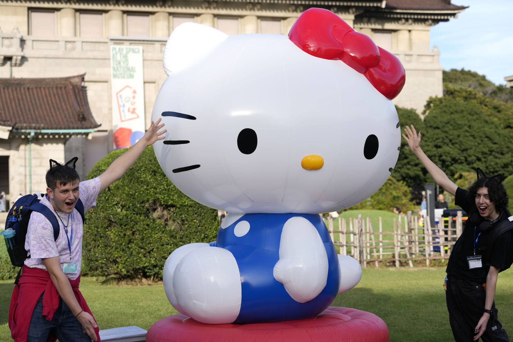 <p>Tourists from Britain pose with Hello Kitty decoration at the Tokyo National Museum where the exhibition "As I change, so does she" is held, marking the 50th anniversary of Hello Kitty in Tokyo Wednesday, Oct. 30, 2024. (AP Photo/Shuji Kajiyama)</p>   PHOTO CREDIT: Shuji Kajiyama - staff, ASSOCIATED PRESS