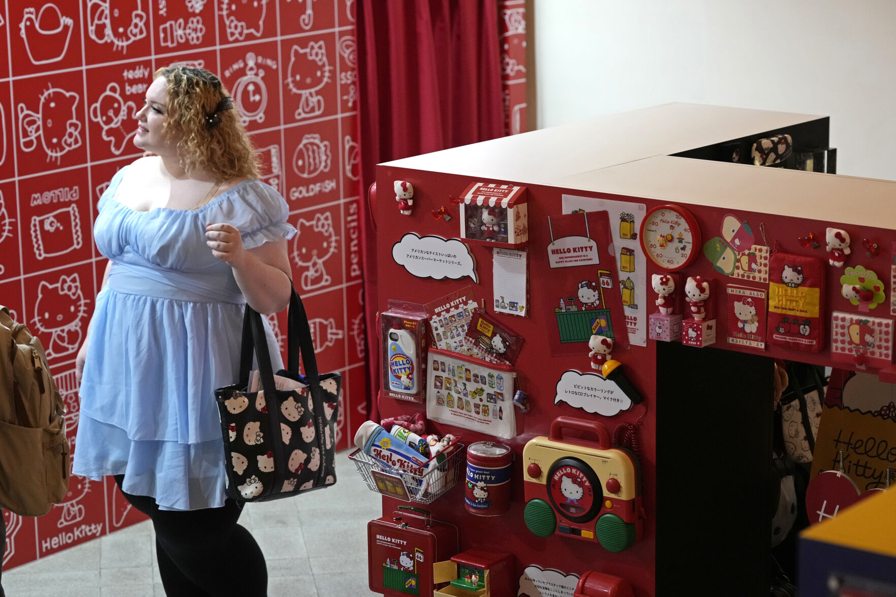 <p>A visitor looks at giant Hello Kitty display at the exhibition "As I change, so does she," marking the 50th anniversary of Hello Kitty at the Tokyo National Museum in Tokyo Wednesday, Oct. 30, 2024. (AP Photo/Shuji Kajiyama)</p>   PHOTO CREDIT: Shuji Kajiyama - staff, ASSOCIATED PRESS