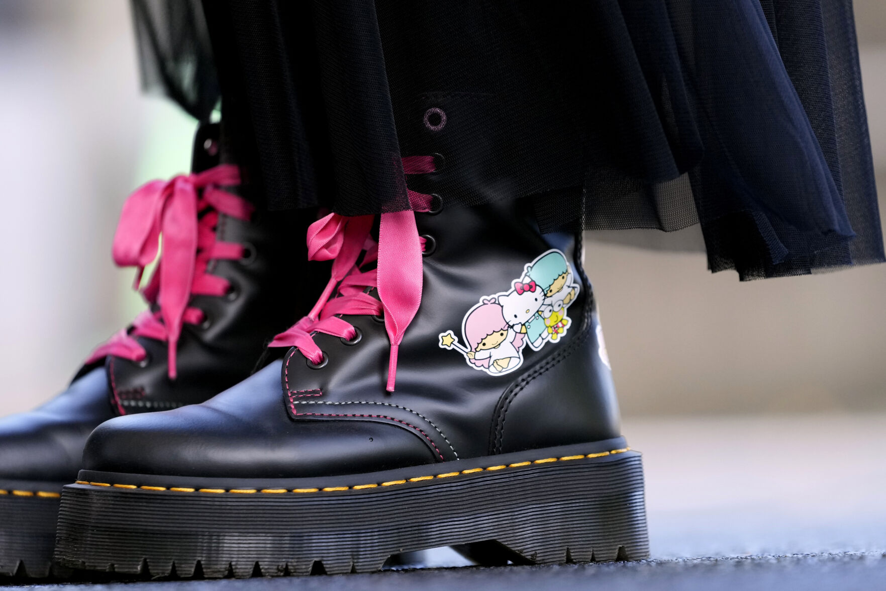 <p>A visitor wears boots featuring Hello Kitty at the National Museum during the exhibition "As I change, so does she," marking the 50th anniversary of Hello Kitty at the Tokyo National Museum in Tokyo Wednesday, Oct. 30, 2024. (AP Photo/Shuji Kajiyama)</p>   PHOTO CREDIT: Shuji Kajiyama - staff, ASSOCIATED PRESS