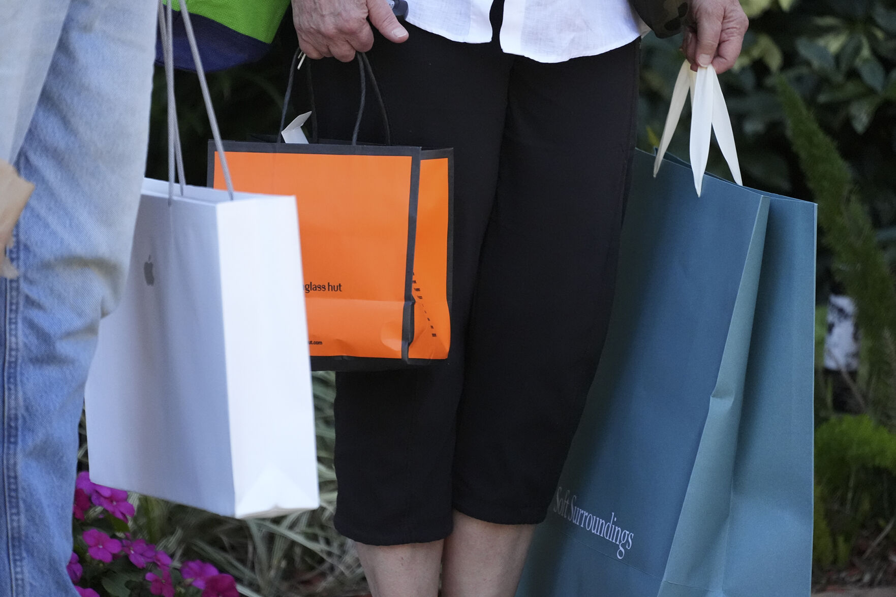 <p>FILE - Shoppers hold bags after shopping in Bradenton, Fla., Feb. 9, 2024. (AP Photo/Gene J. Puskar. File)</p>   PHOTO CREDIT: GJP - staff, ASSOCIATED PRESS