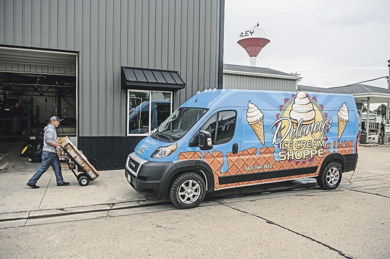 Always moving, Matt Delaney loads one of three mobile ice cream trucks now in service.    PHOTO CREDIT: Dave LaBelle • Staff Photo