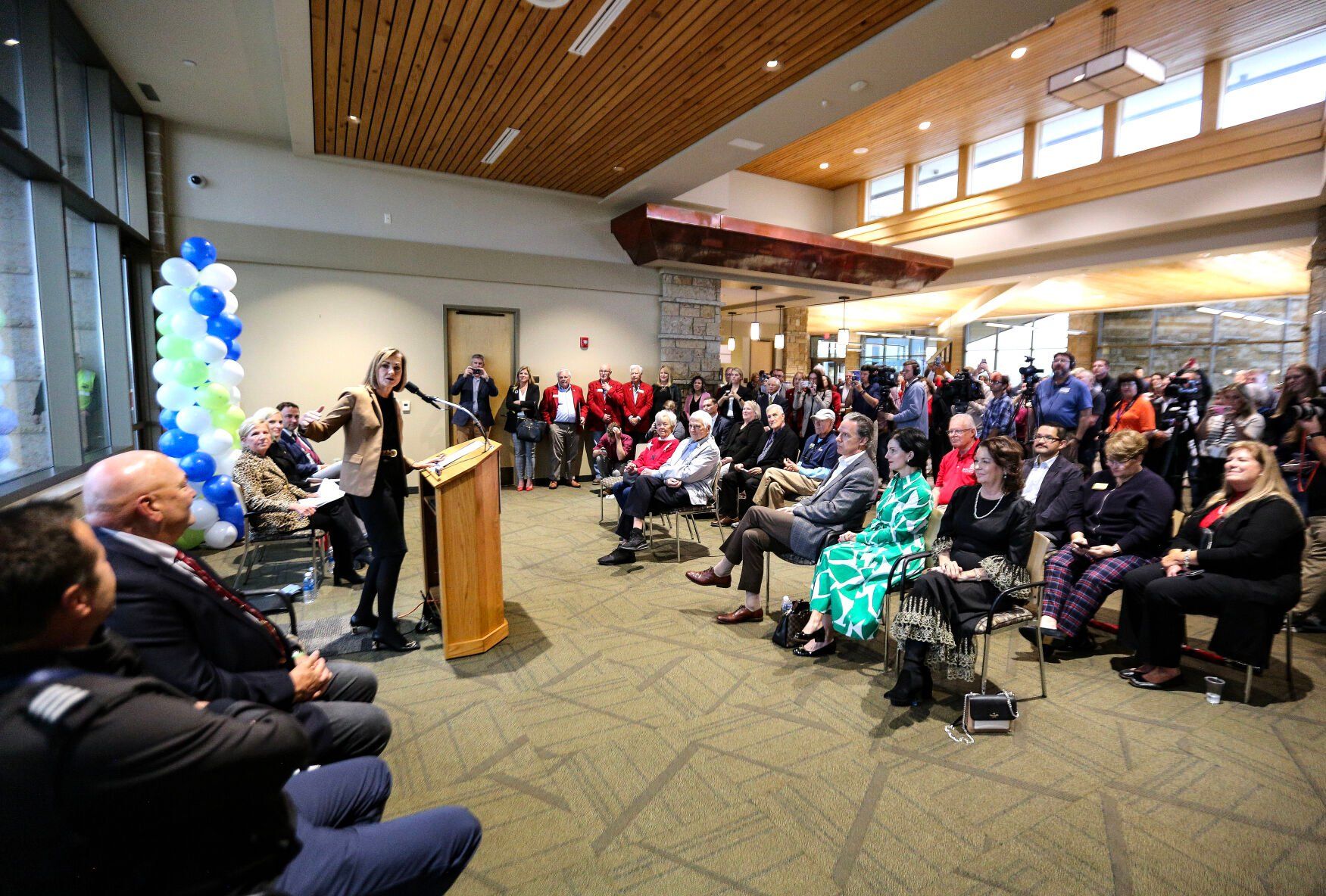 Iowa Gov. Kim Reynolds speaks during a ceremony for the first flight of Denver Air Connection at the Robert L. Martin Terminal on Monday.    PHOTO CREDIT: Dave Kettering