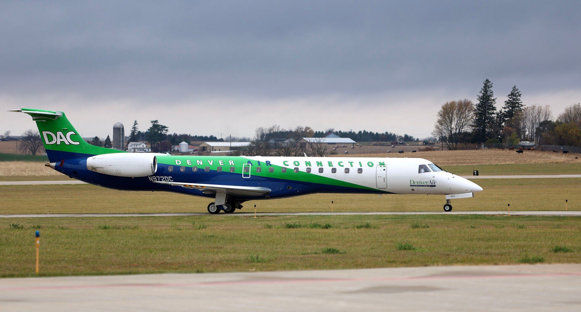 The first flight of Denver Air Connection from Chicago to Dubuque taxies to the Robert L. Martin Terminal on Monday.    PHOTO CREDIT: Dave Kettering