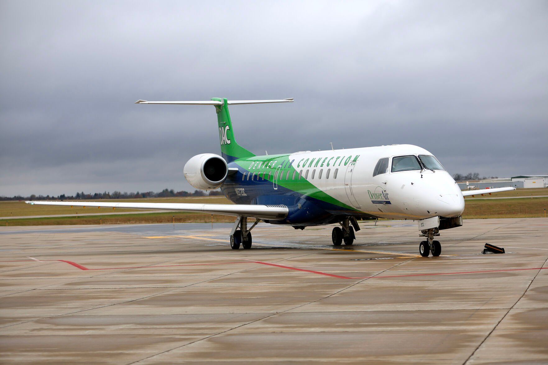 Denver Air Connection maneuvers to the terminal of the Robert L. Martin Terminal at Dubuque Regional Airport on Monday.    PHOTO CREDIT: Dave Kettering