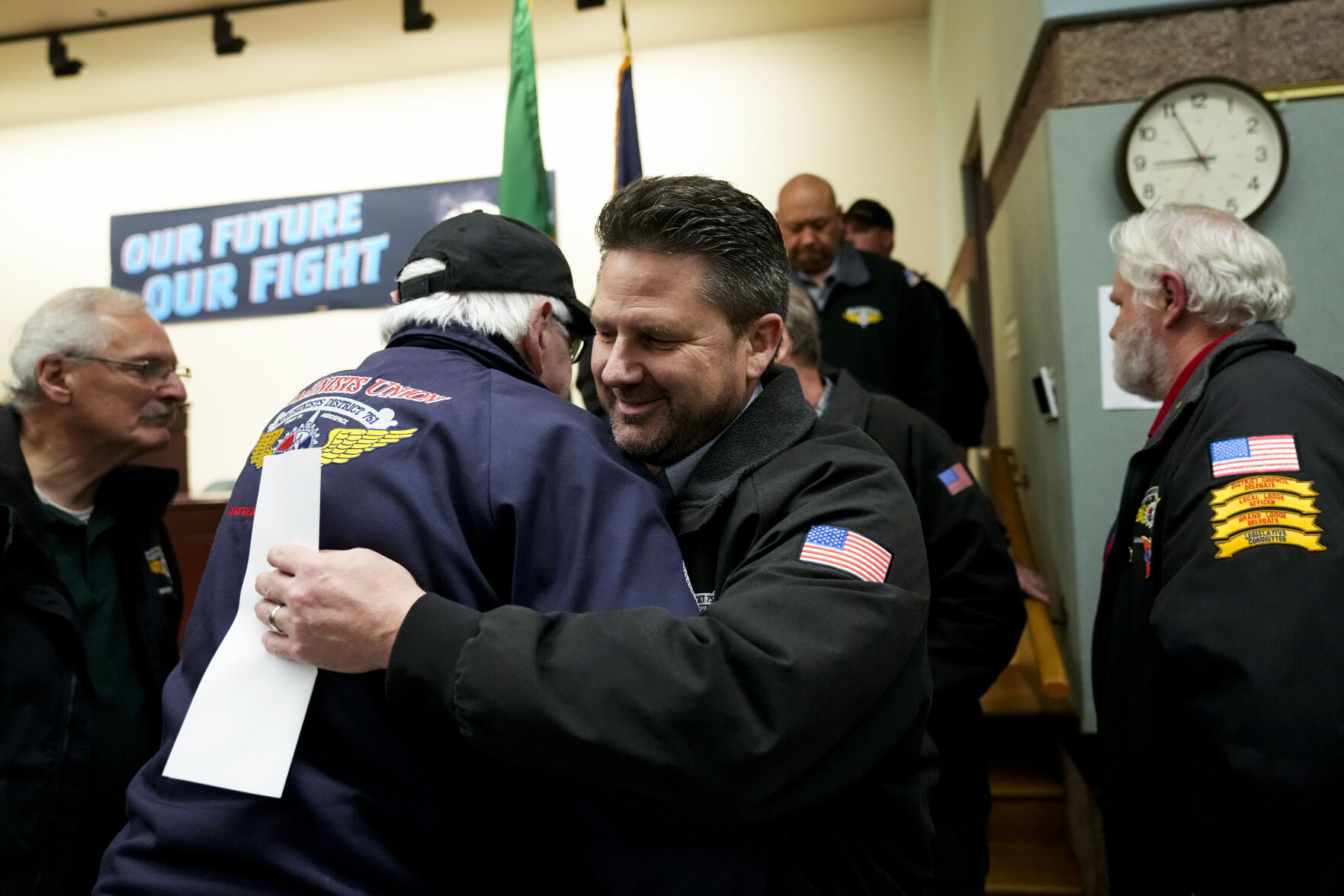 <p>IAM District 751 president Jon Holden greets union members after announcing they voted to accept a new contract offer from Boeing, Monday, Nov. 4, 2024, at their union hall in Seattle. (AP Photo/Lindsey Wasson)</p>   PHOTO CREDIT: Lindsey Wasson 