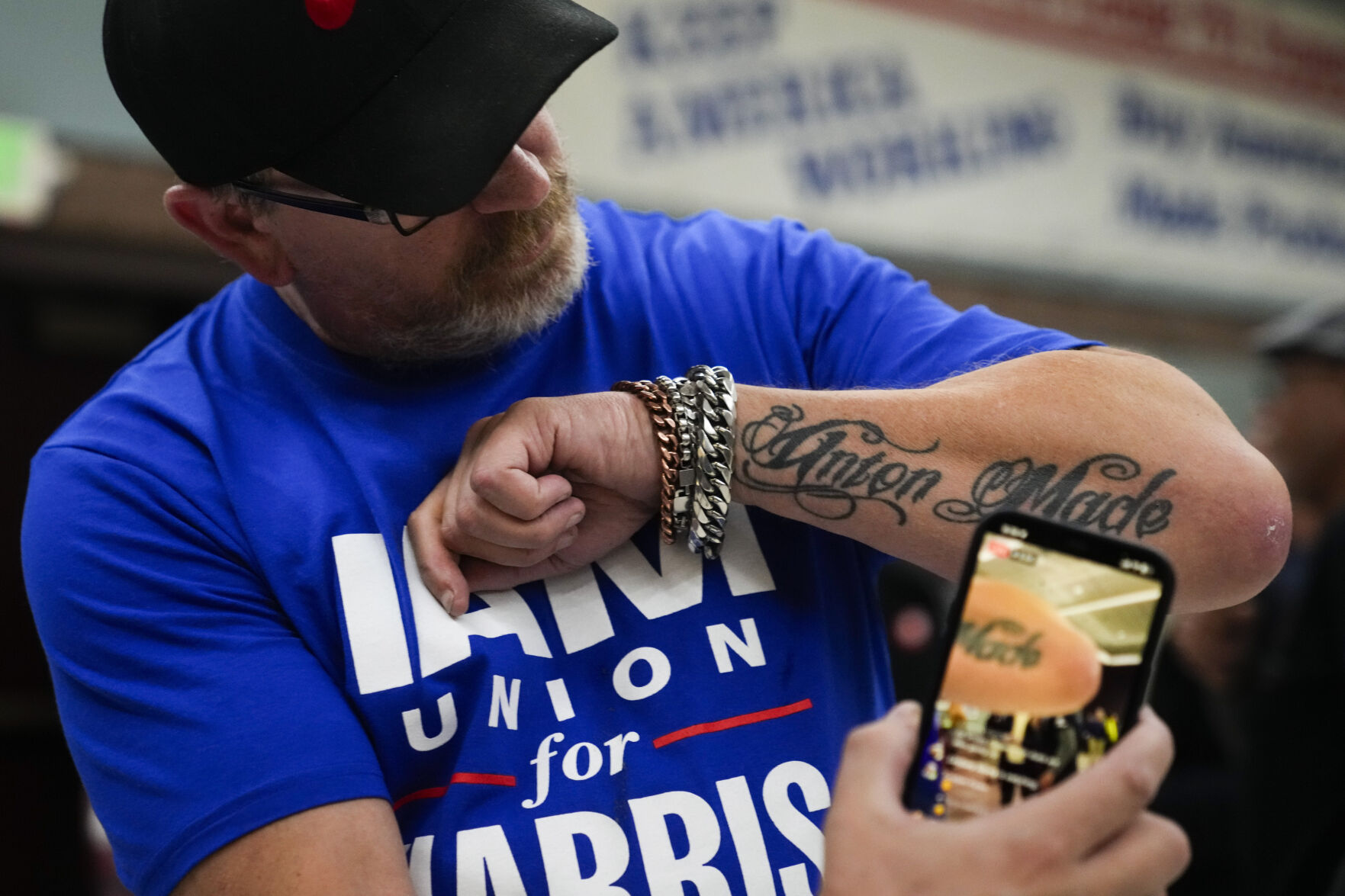 <p>Ed Lutgen shows off his tattoo while waiting to hear the results of the union vote on a new contract offer from Boeing, Monday, Nov. 4, 2024, at IAM District 751 Union Hall in Seattle. (AP Photo/Lindsey Wasson)</p>   PHOTO CREDIT: Lindsey Wasson - staff, ASSOCIATED PRESS