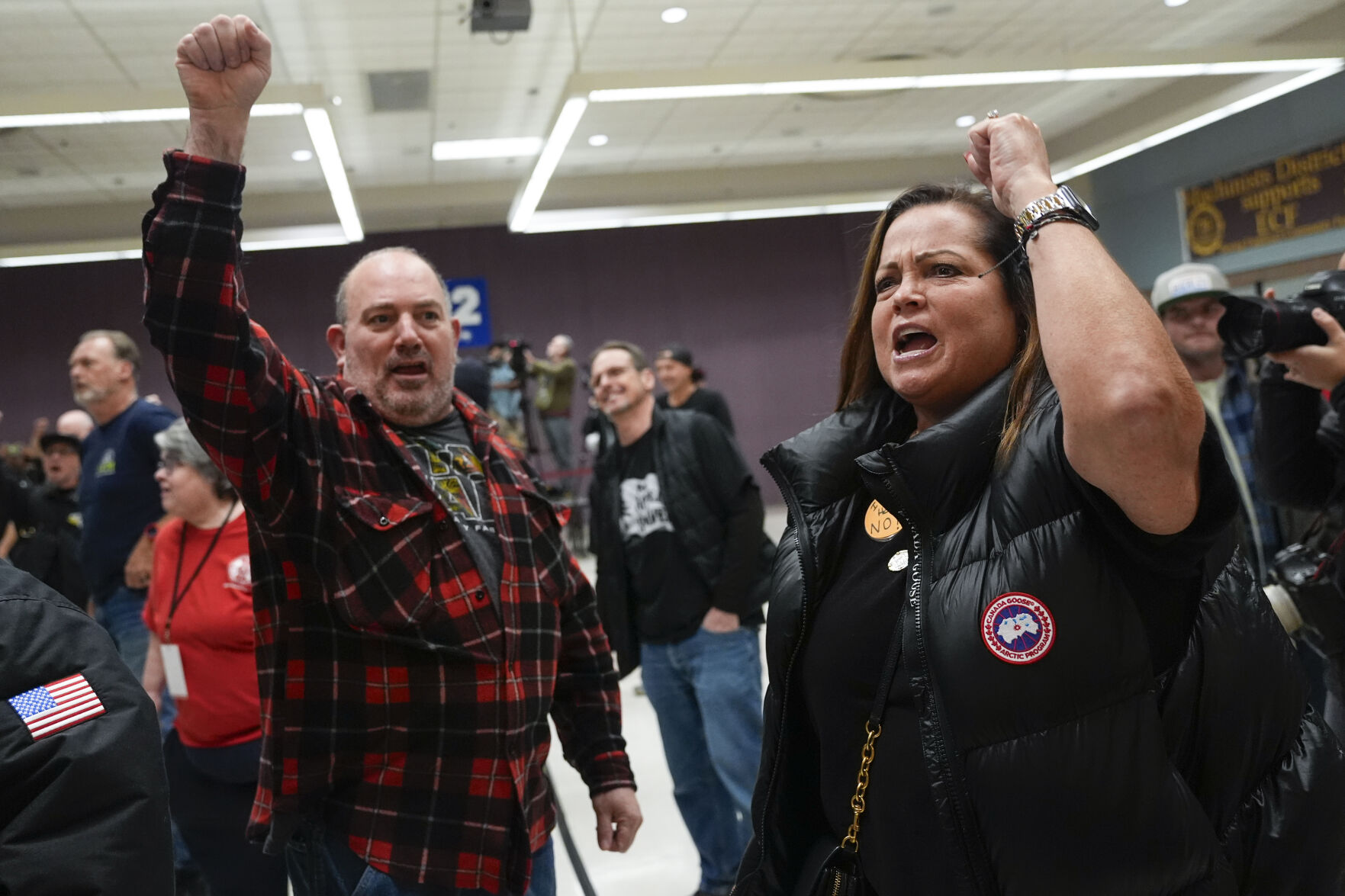 <p>Boeing employees Harold Ruffalo, left, and Gina Forbush, right, react to the announcement that union members voted to reject a new contract offer from the company, Wednesday, Oct. 23, 2024, at Seattle Union Hall in Seattle. (AP Photo/Lindsey Wasson)</p>   PHOTO CREDIT: Lindsey Wasson - staff, ASSOCIATED PRESS