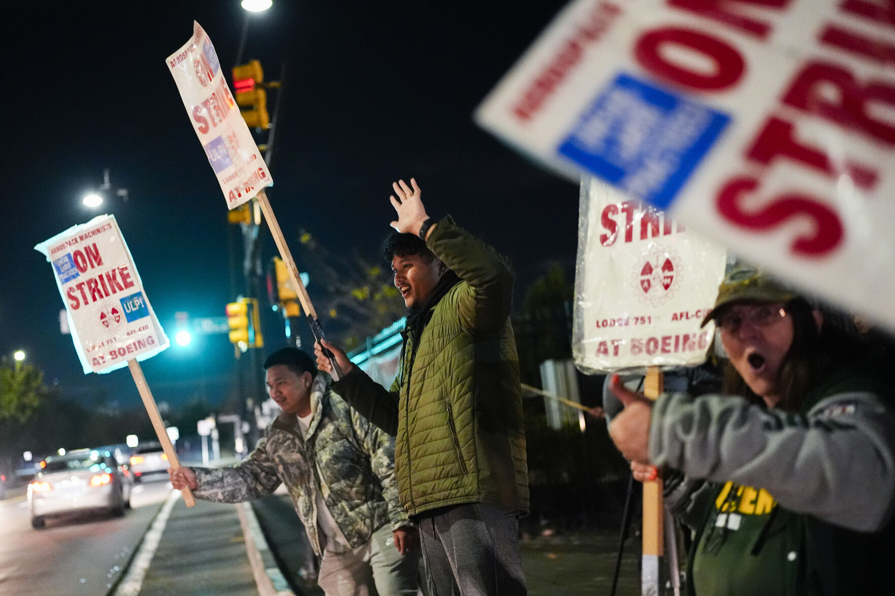 <p>Boeing employees, including assembler Tyrone Hipolito, center, work the picket line after union members voted to reject a new contract offer from the company, Wednesday, Oct. 23, 2024, in Renton, Wash. (AP Photo/Lindsey Wasson)</p>   PHOTO CREDIT: Lindsey Wasson - staff, ASSOCIATED PRESS