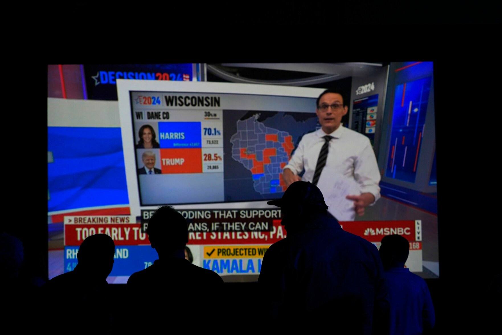 <p>People watch results come in on a television screen at the DFL electionnight party, Tuesday, Nov. 5, 2024, in St. Paul, Minn. (AP Photo/Abbie Parr)</p>   PHOTO CREDIT: Abbie Parr