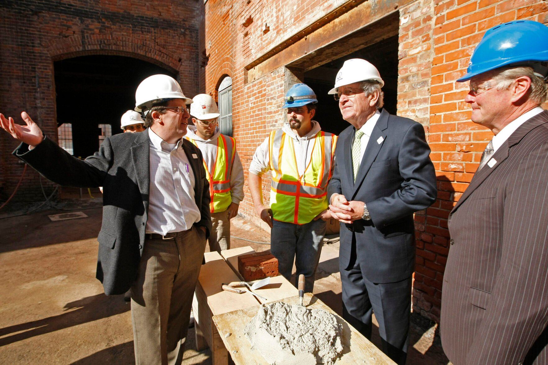 Dubuque developer John Gronen (left) shows off the CARADCO building to U.S. Sen. Tom Harkin, D-Iowa, after a groundbreaking ceremony for the renovation project in the city’s historic millwork district on Oct. 14, 2011.    PHOTO CREDIT: TH file