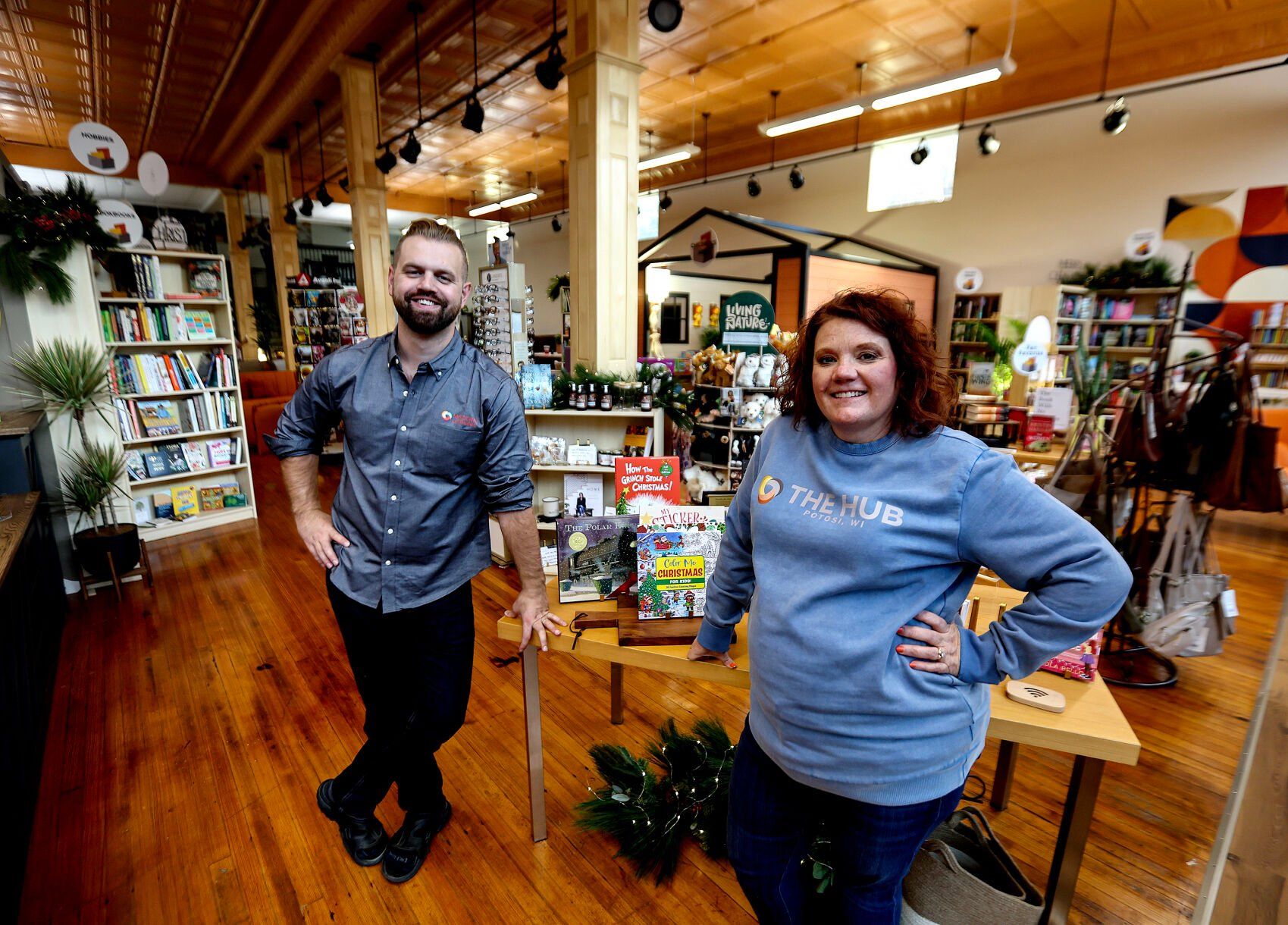 Owner Melissa Emler (right) and director of operations Ray Schink stand inside the building that houses The Hub, a coworking space, and Pages and Parcels, a retail and shipping business, in Potosi, Wis.    PHOTO CREDIT: Dave Kettering