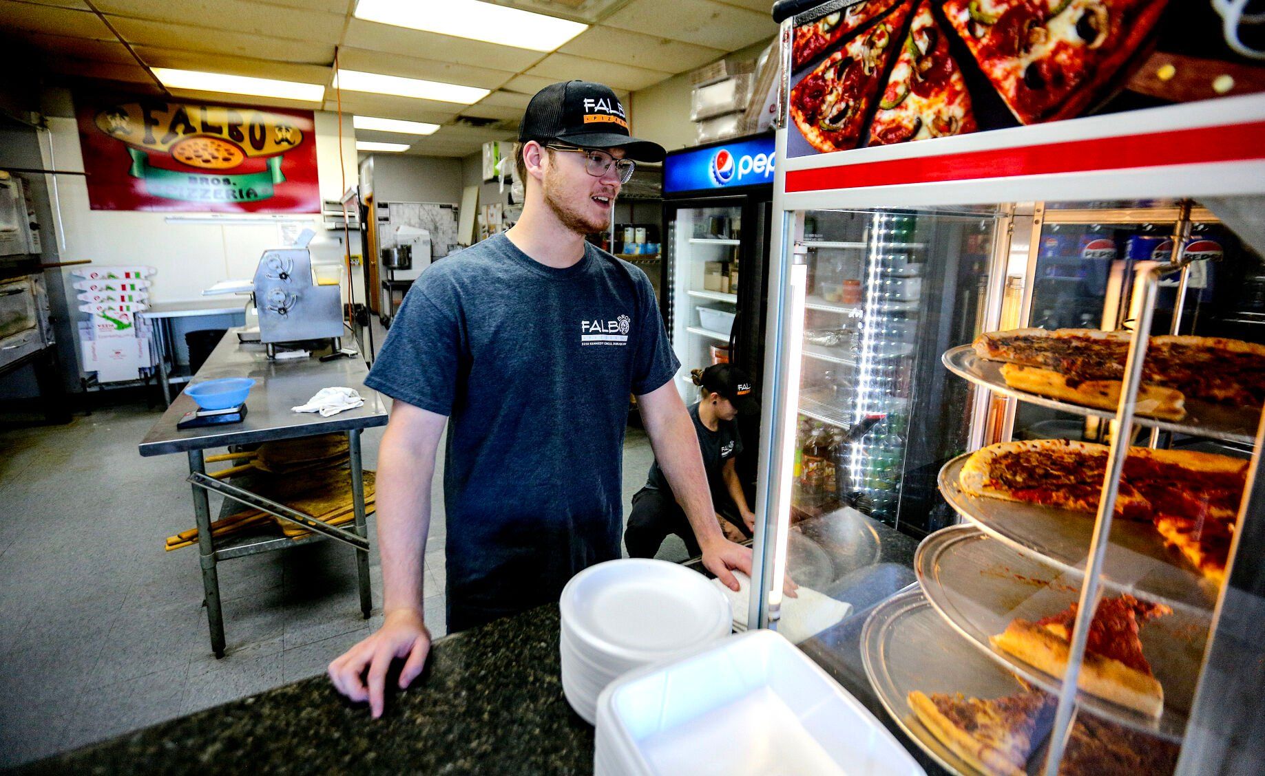 Aidan Brown, 19, is the new owner of Falbo Bros. Pizzeria in Dubuque.    PHOTO CREDIT: Dave Kettering