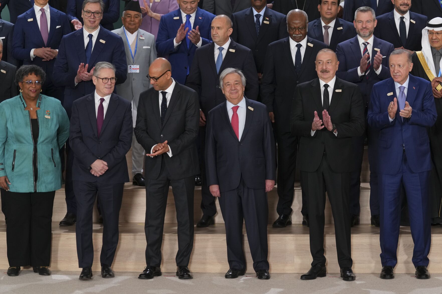 <p>Barbados Prime Minister Mia Mottley, United Kingdom Prime Minister Keir Starmer, Simon Stiell, United Nations climate chief, Antonio Guterres, United Nations secretary-general, Ilham Aliyev, Azerbaijan president and Turkey President Recep Tayyip front center, pose with others for a group photo at the COP29 U.N. Climate Summit, Tuesday, Nov. 12, 2024, in Baku, Azerbaijan. (AP Photo/Peter Dejong)</p>   PHOTO CREDIT: Peter Dejong 