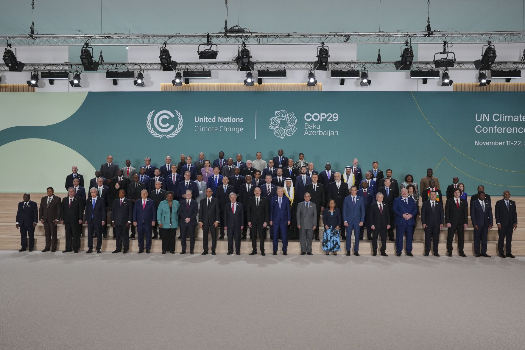 <p>Barbados Prime Minister Mia Mottley, United Kingdom Prime Minister Keir Starmer, Simon Stiell, United Nations climate chief, Antonio Guterres, United Nations secretary-general, Ilham Aliyev, Azerbaijan president, and Turkey President Recep Tayyip, in the center, pose with others for a group photo at the COP29 U.N. Climate Summit, Tuesday, Nov. 12, 2024, in Baku, Azerbaijan. (AP Photo/Peter Dejong)</p>   PHOTO CREDIT: Peter Dejong - staff, ASSOCIATED PRESS