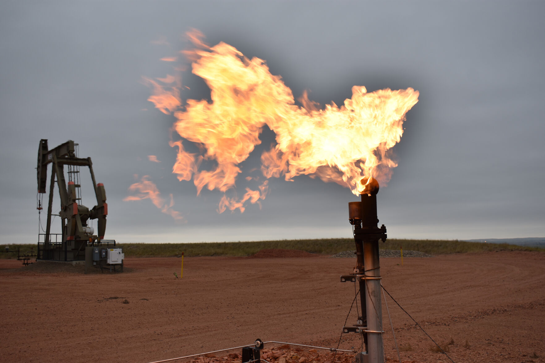 <p>FILE - A flare burns natural gas at an oil well in Watford City, N.D., Aug. 26, 2021. (AP Photo/Matthew Brown, File)</p>   PHOTO CREDIT: Matthew Brown 